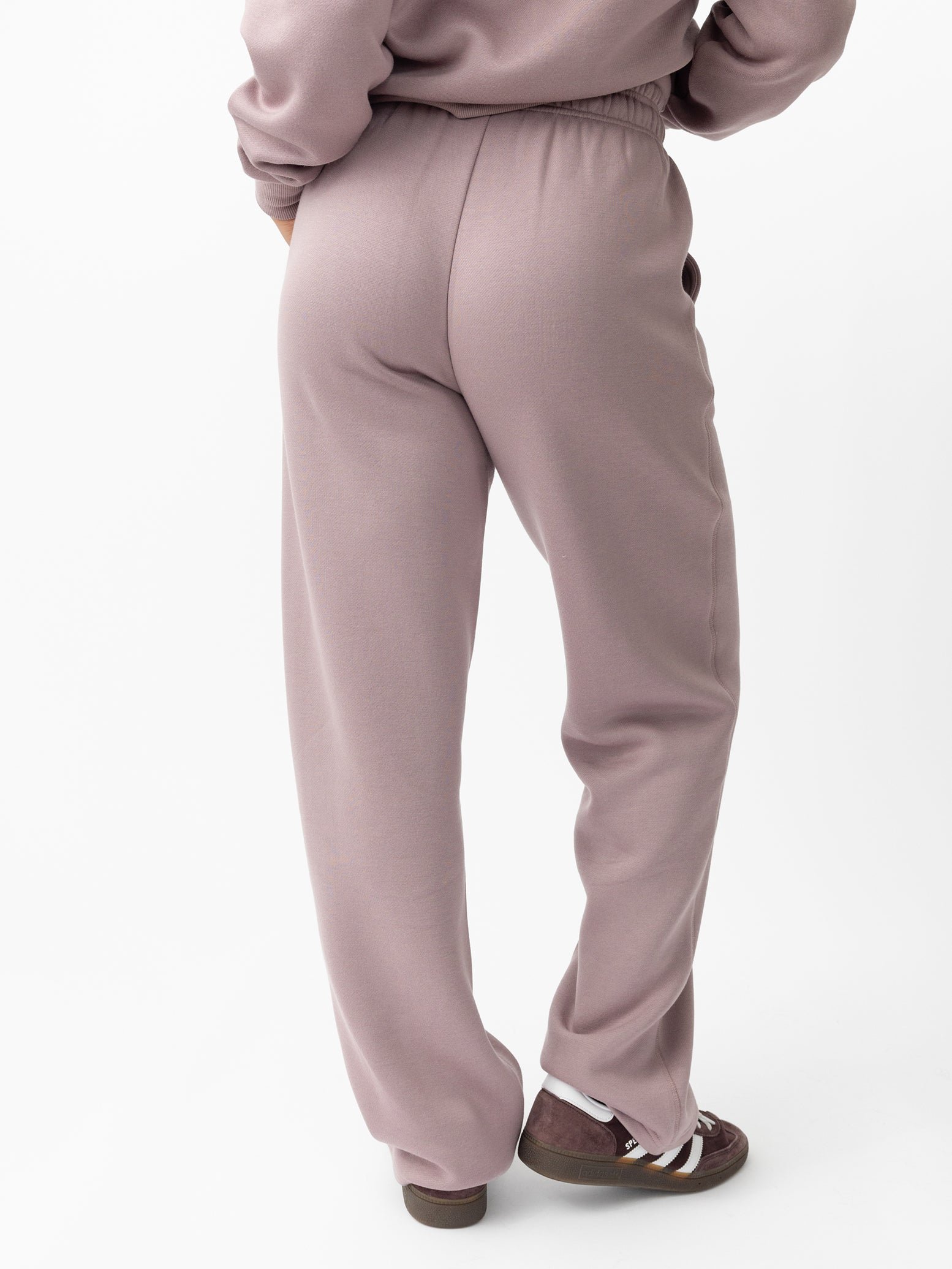 Woman wearing Dusty Orchid CityScape Wide Leg Pant with white background 