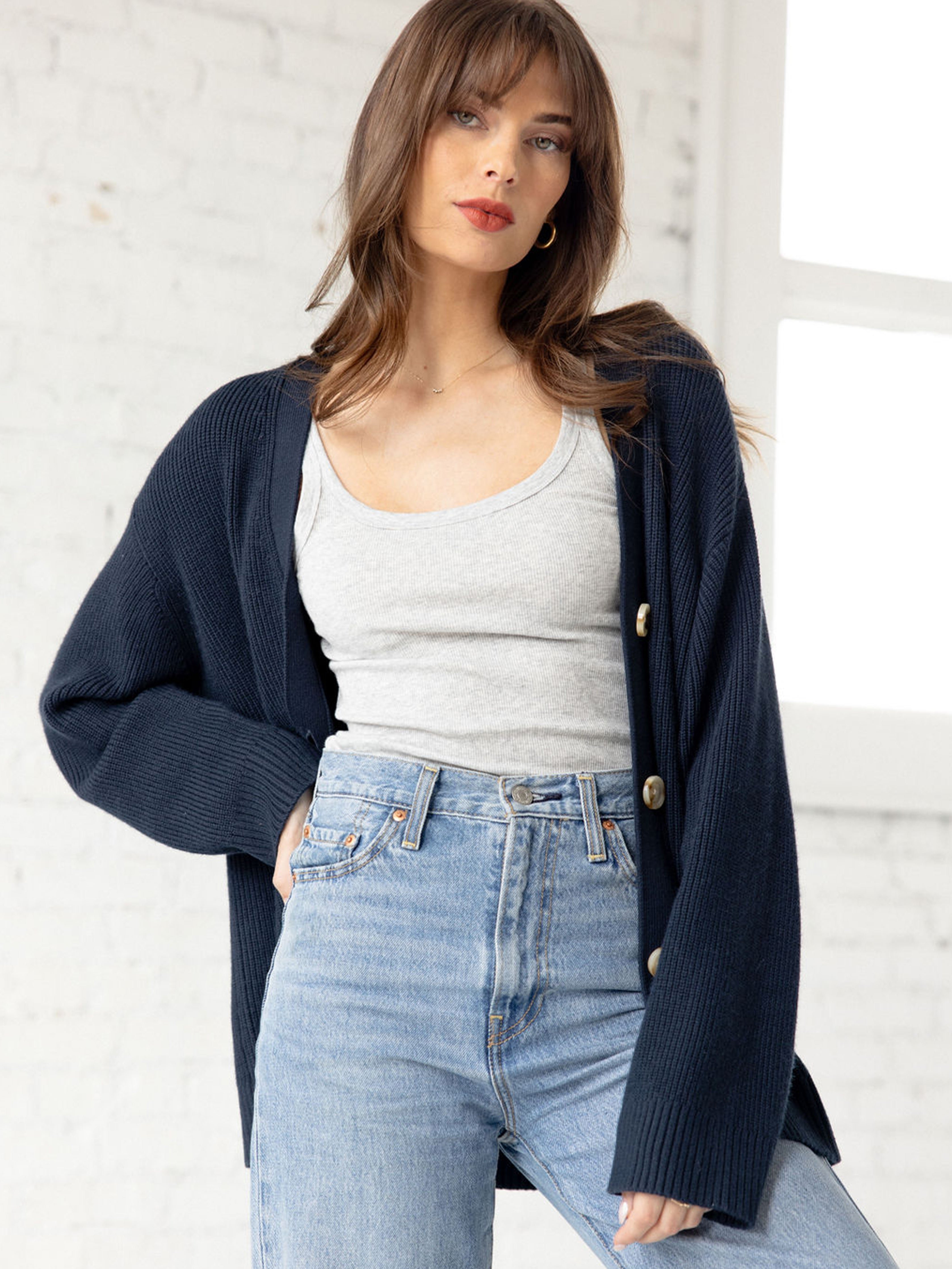 Woman wearing grey tank, jeans, and eclipse cardigan 