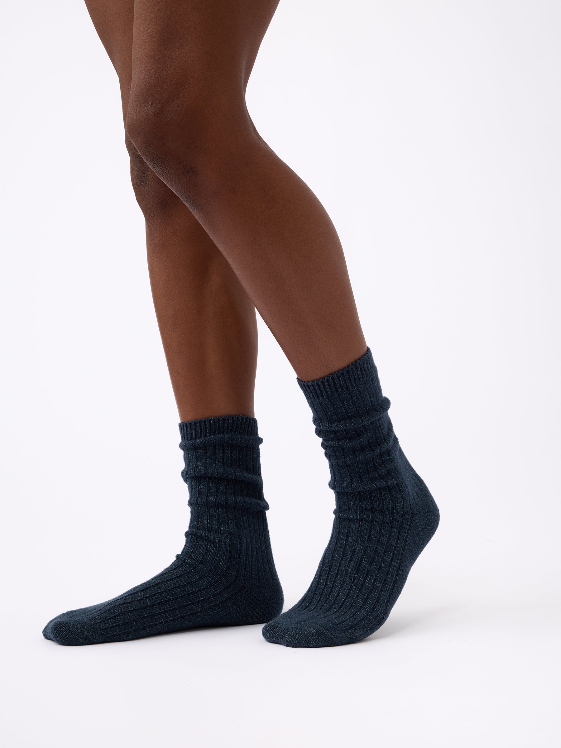 Person wearing Cozy Earth Plush Lounge Sock in Eclipse |Color:Eclipse/Deep Blue/Smokey Blue