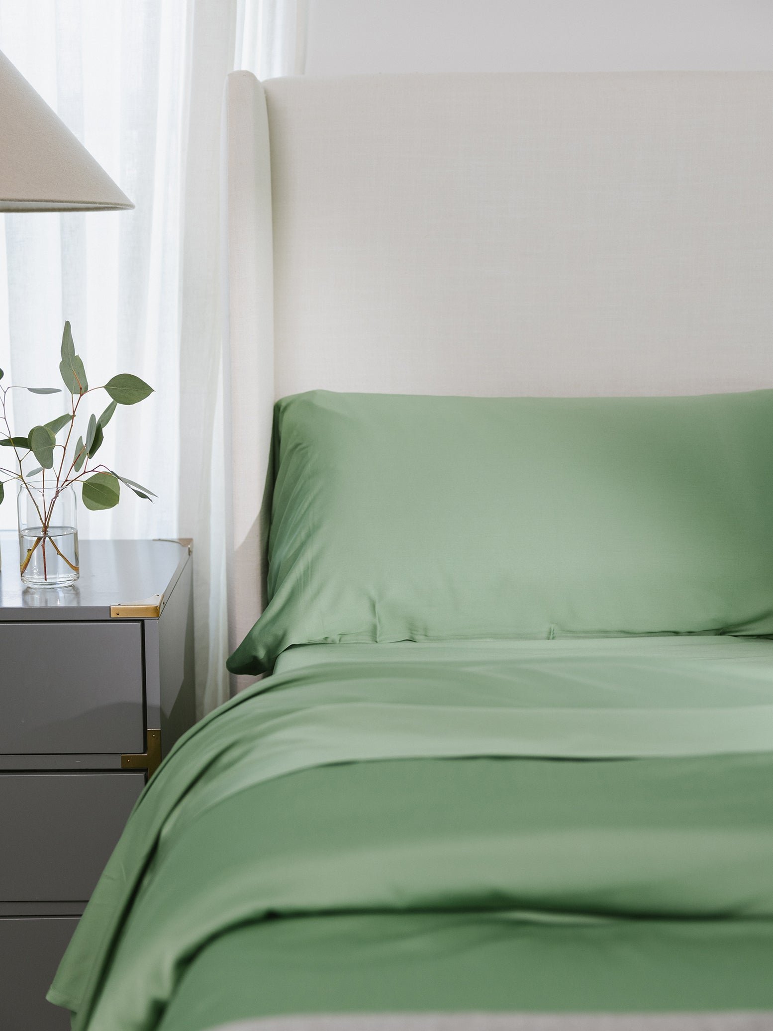 Bed with fern colored duvet cover and sheet set 