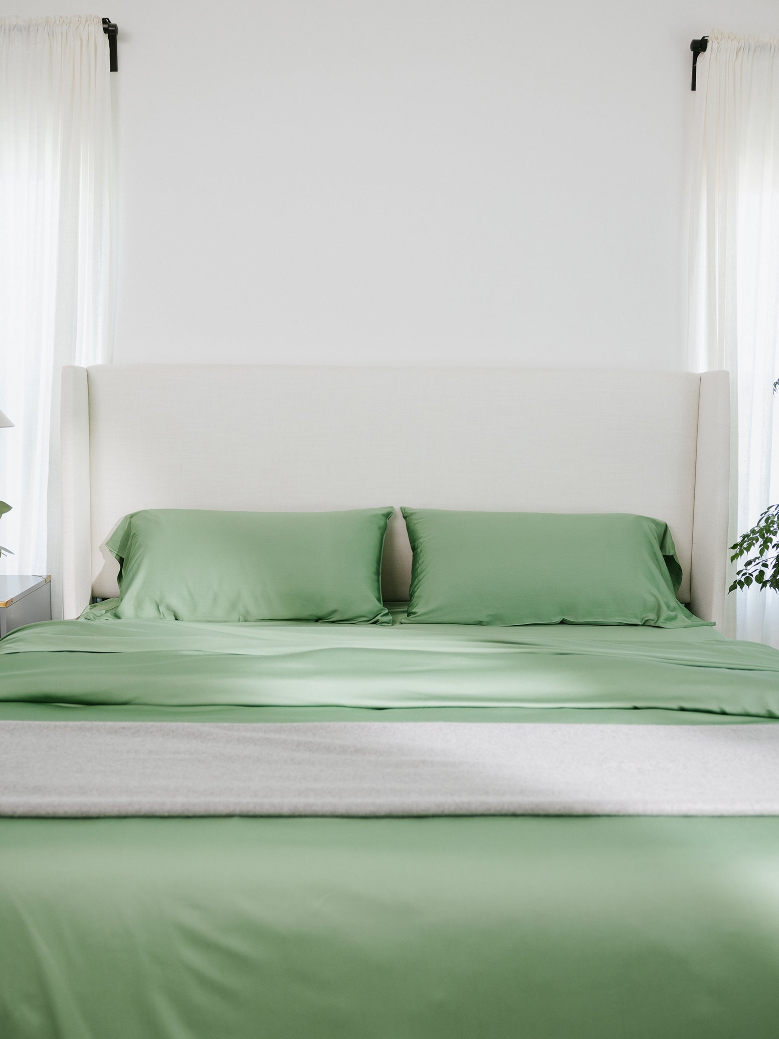 Bed with fern colored duvet cover and sheet set 