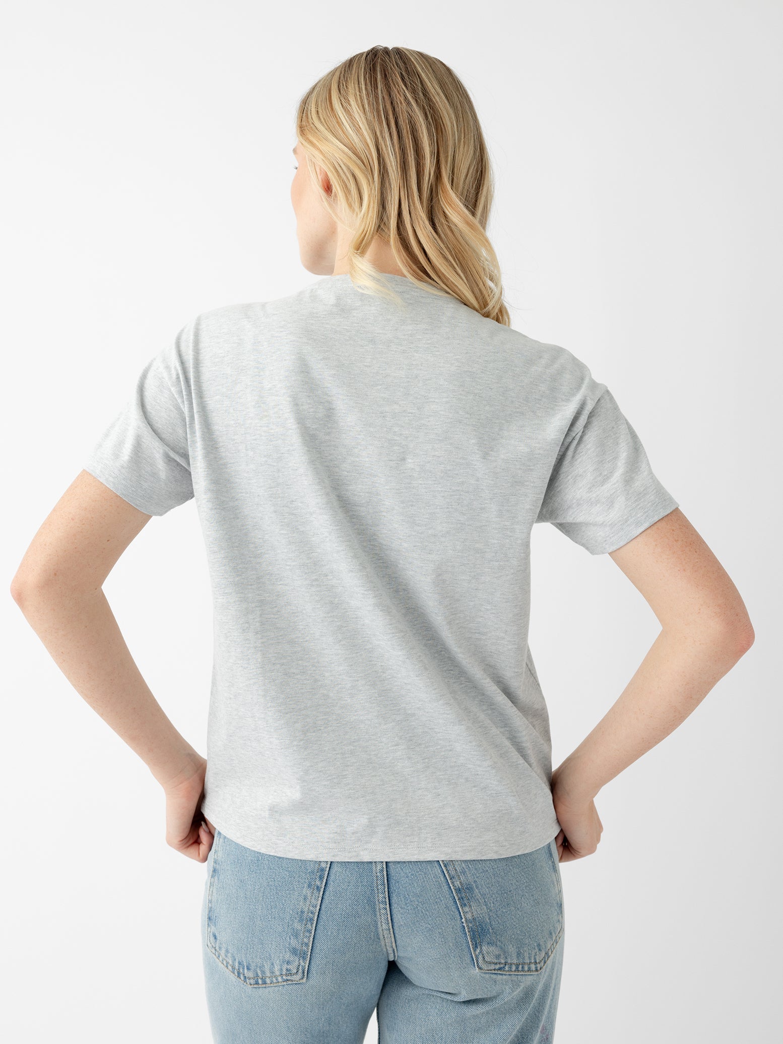 Back of woman wearing french dove heather tee 