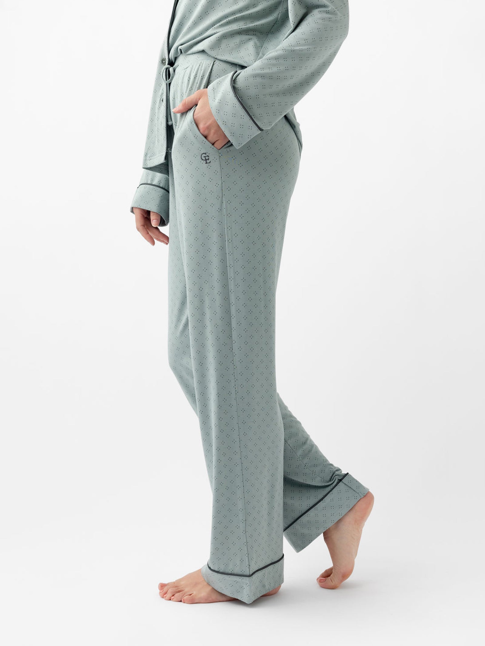 Side view of woman's haze diamond dot pajama pants with white background 