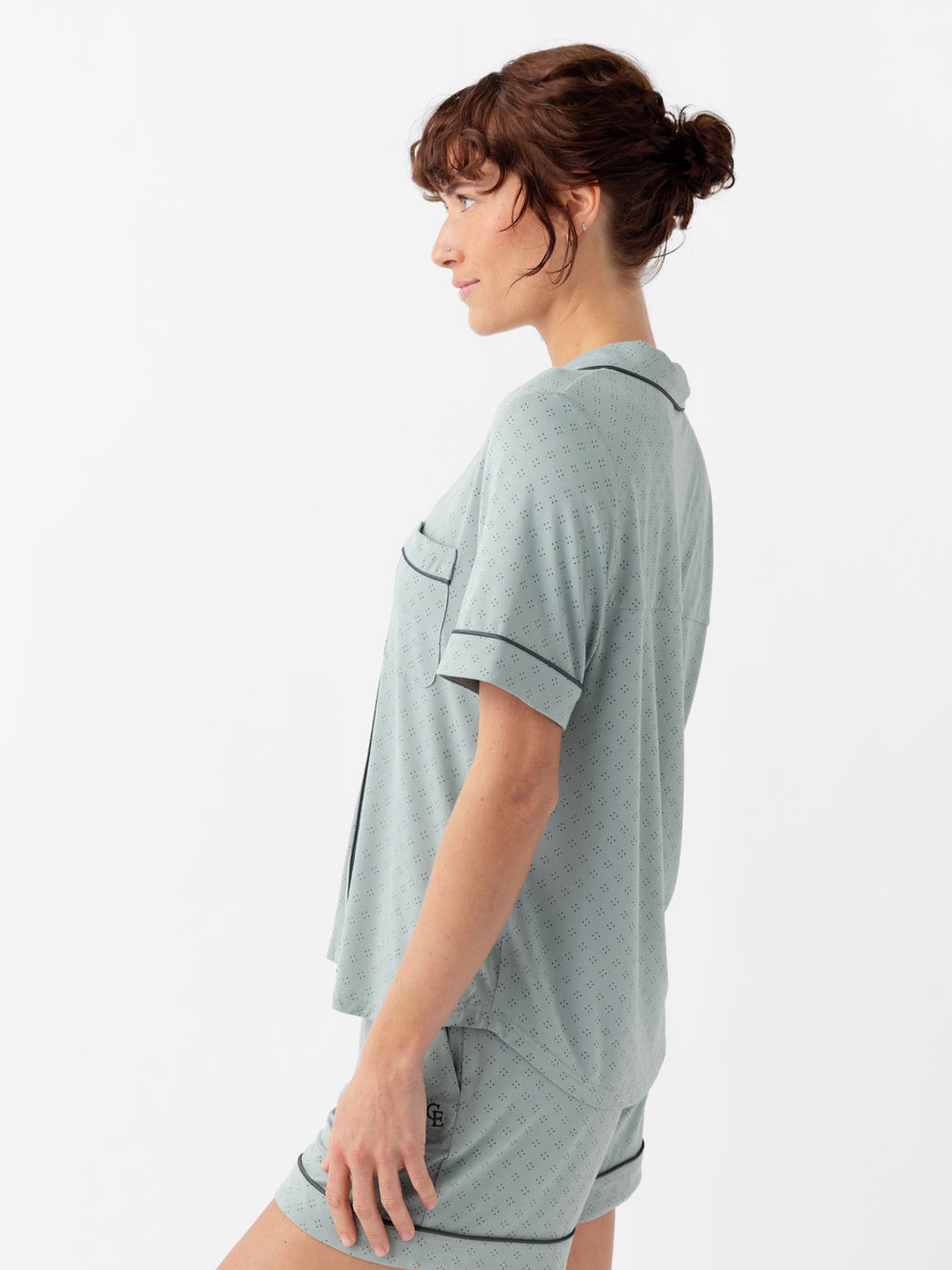 Side view of woman wearing haze diamond dot pajama top with white background 