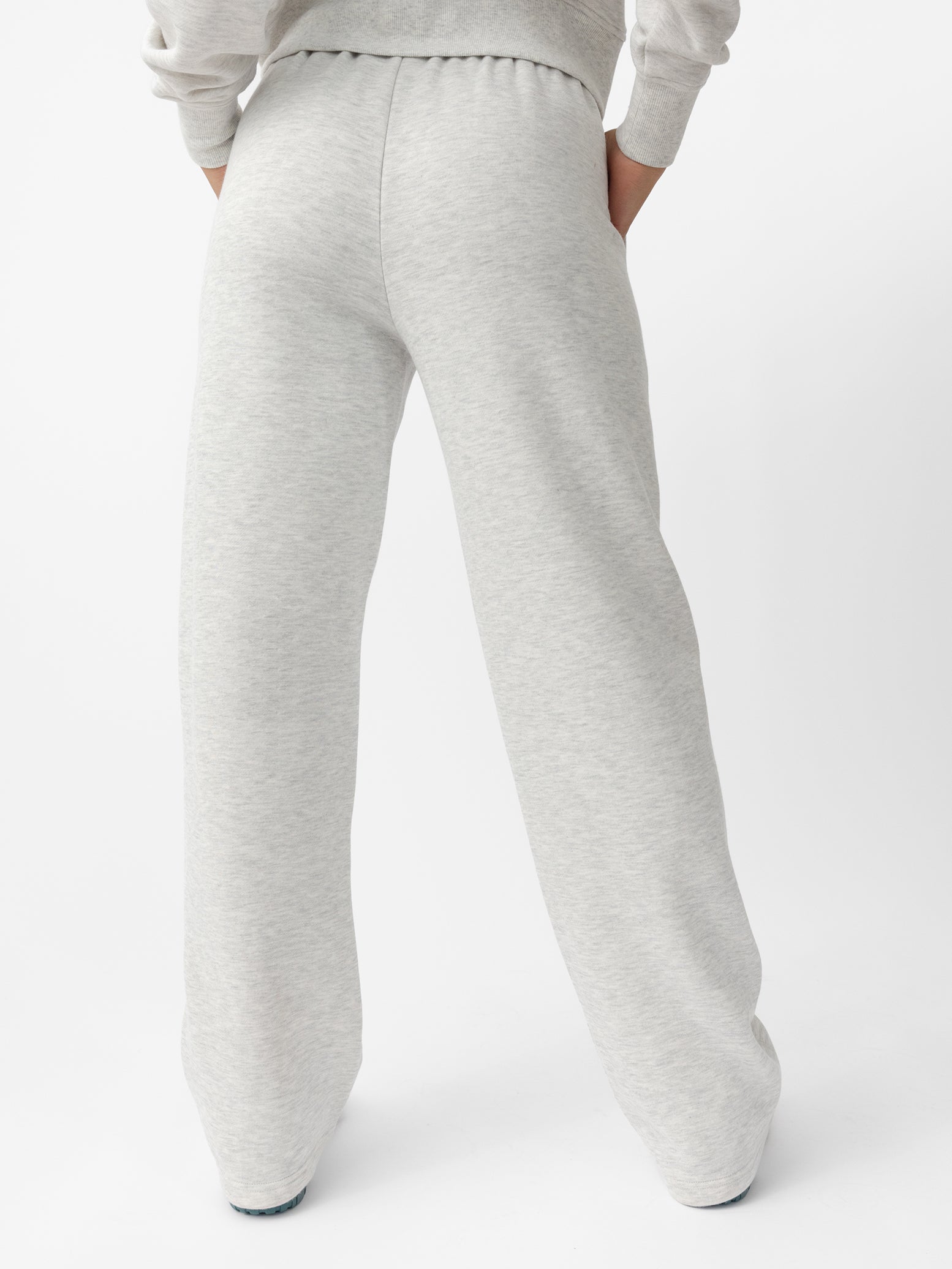 Woman wearing Heather Grey CityScape Wide Leg Pant with white background |Color: Heather Grey