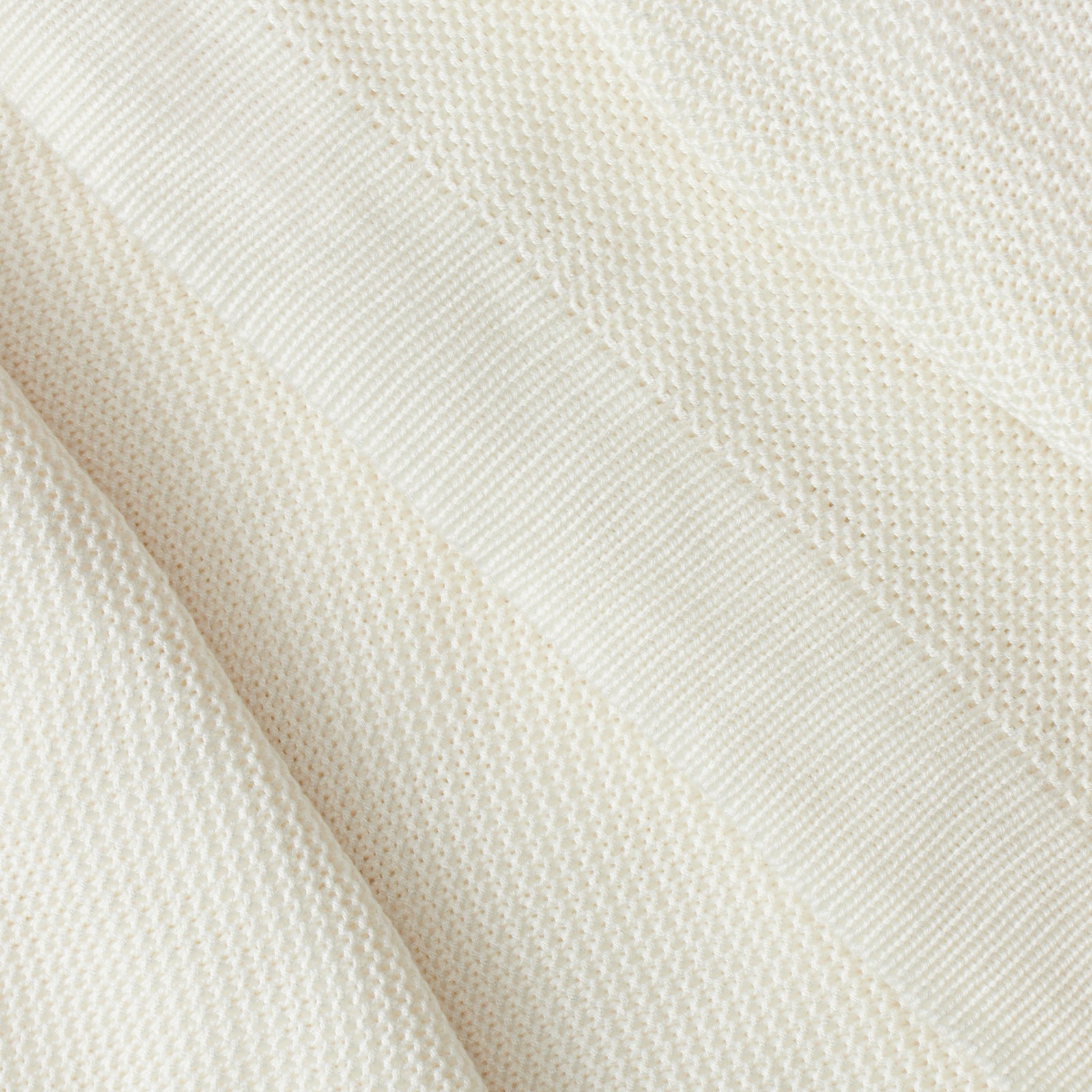 Close up of ivory cloud knit blanket 