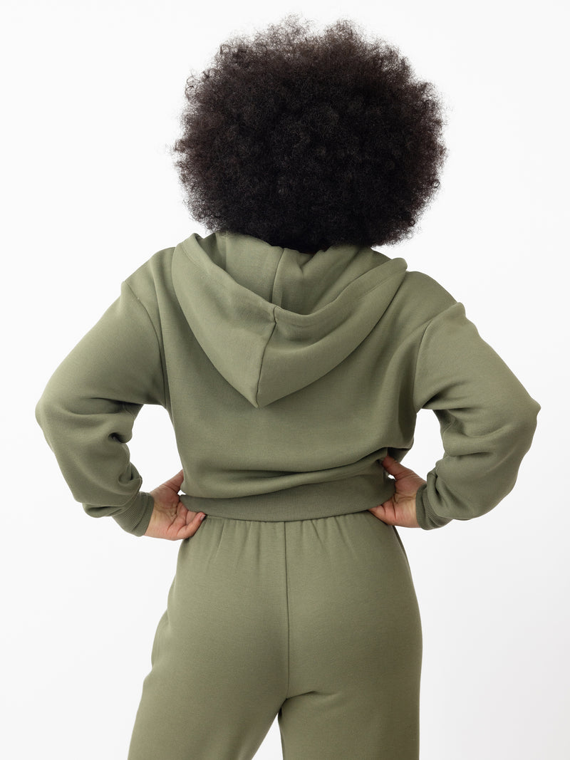 Woman wearing Juniper CityScape Cropped Full Zip with white background