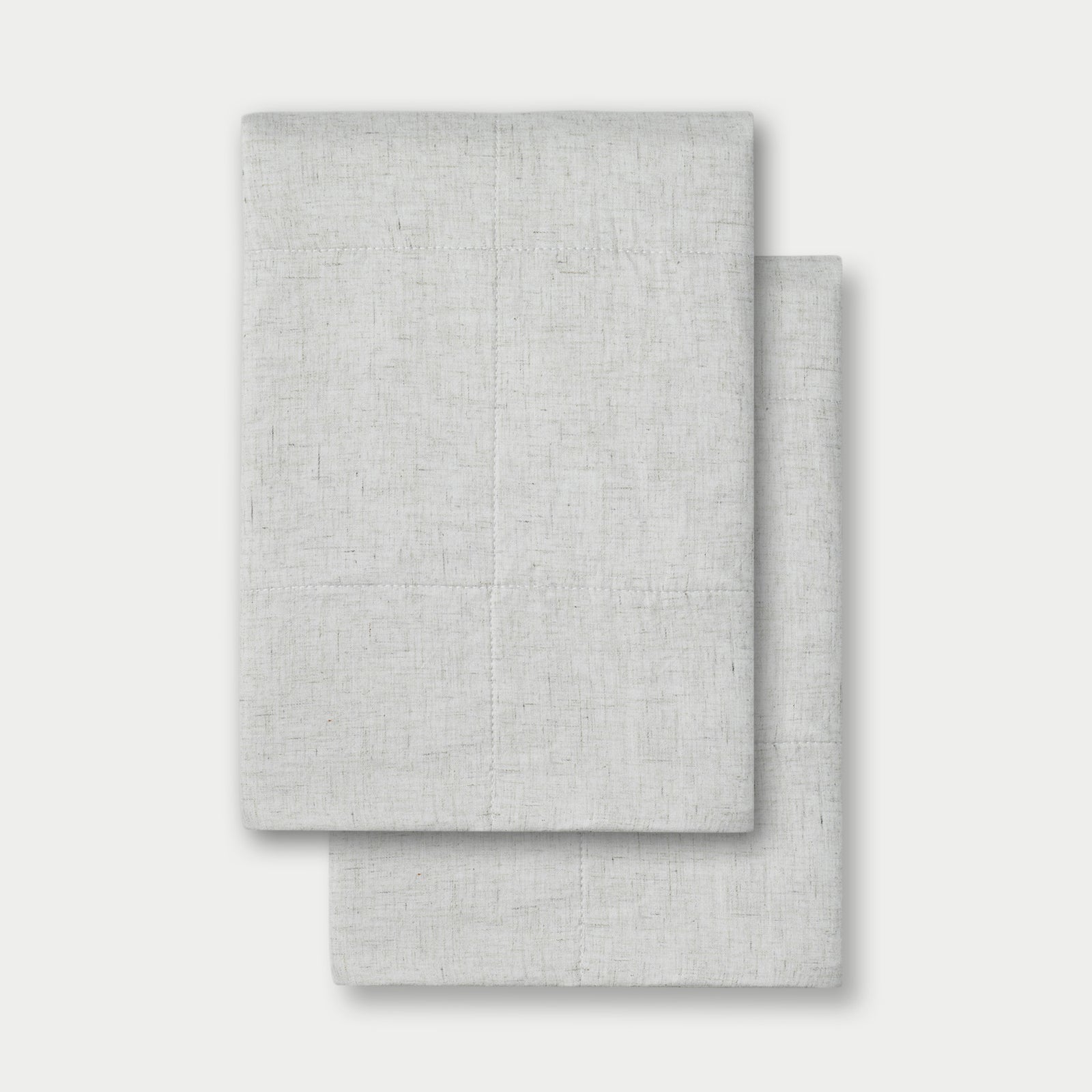 Light Grey Linen Box Quilt Sham neatly folded over white background. 