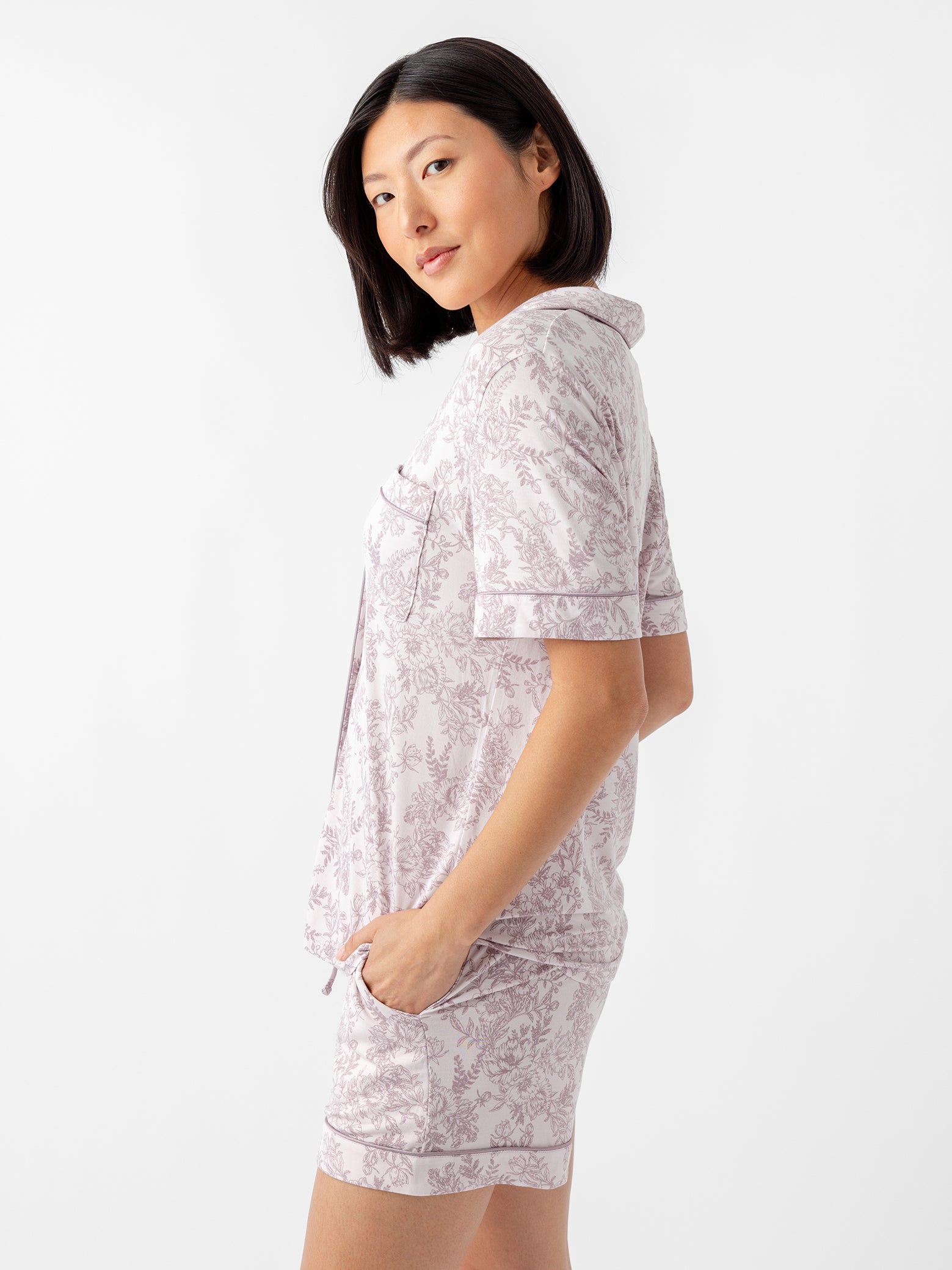 Side view of woman in lilac toile pajama set 