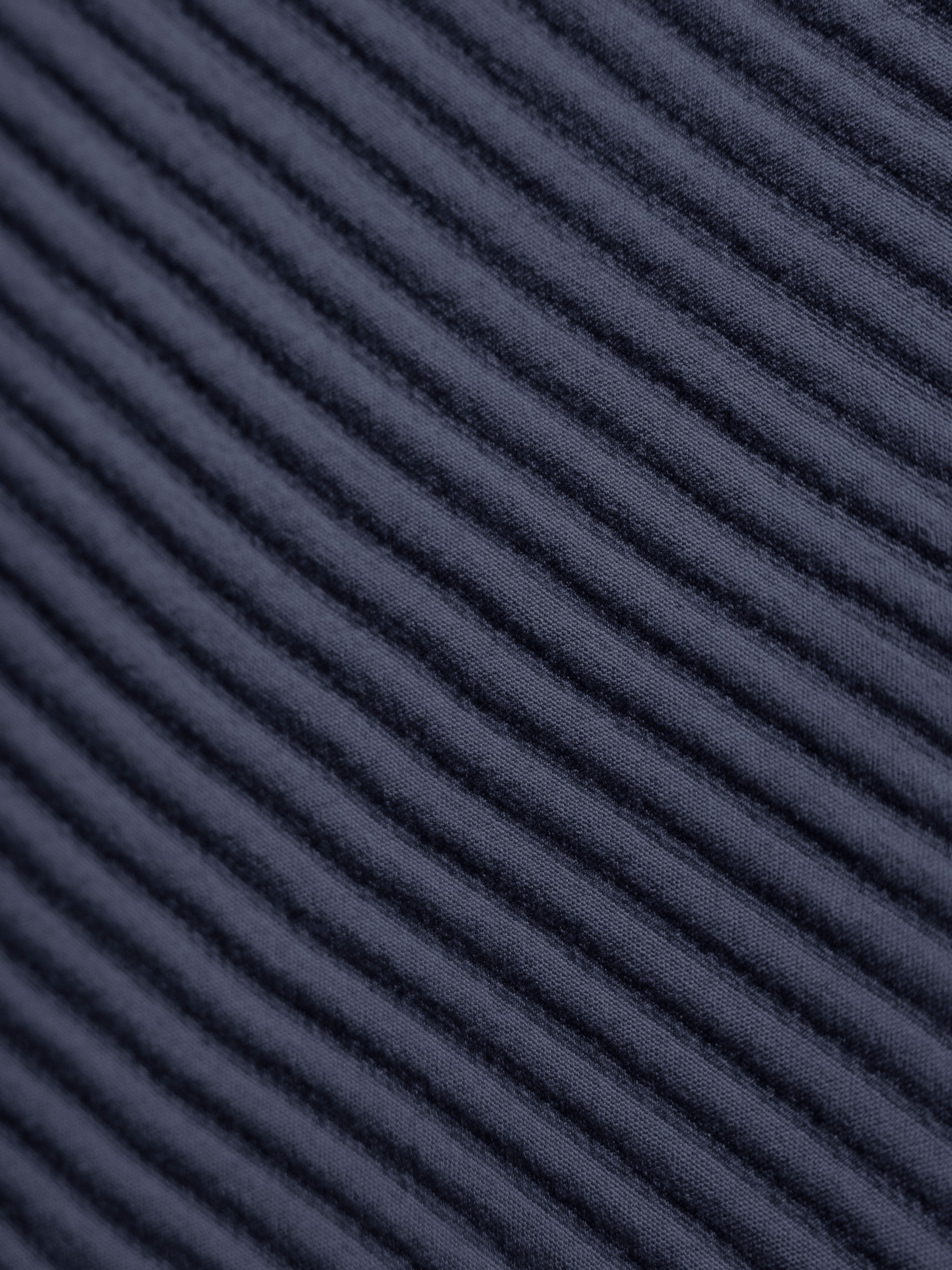 Close up of navy coverlet fabric 
