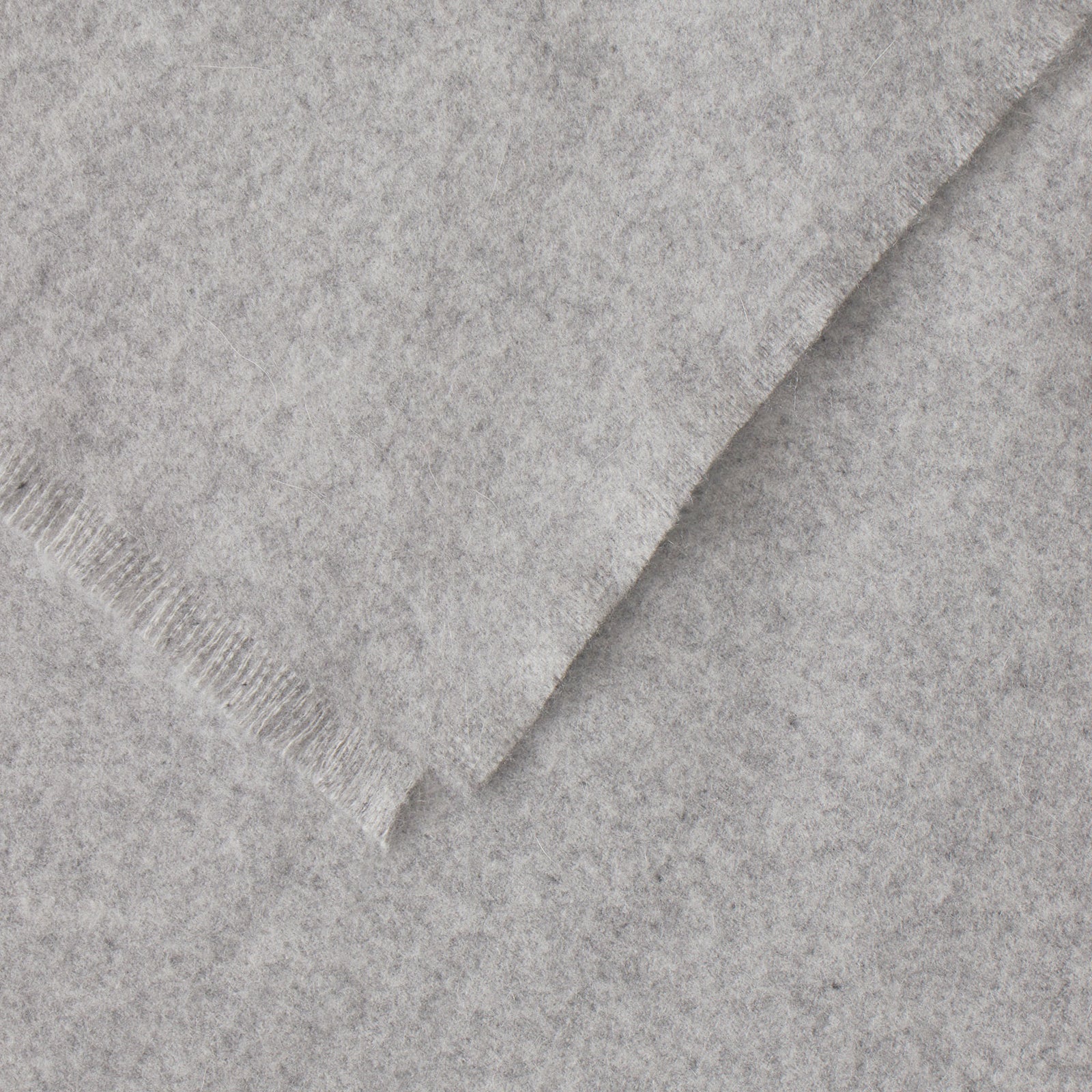 Close up of corner on pebble fringe blanket 