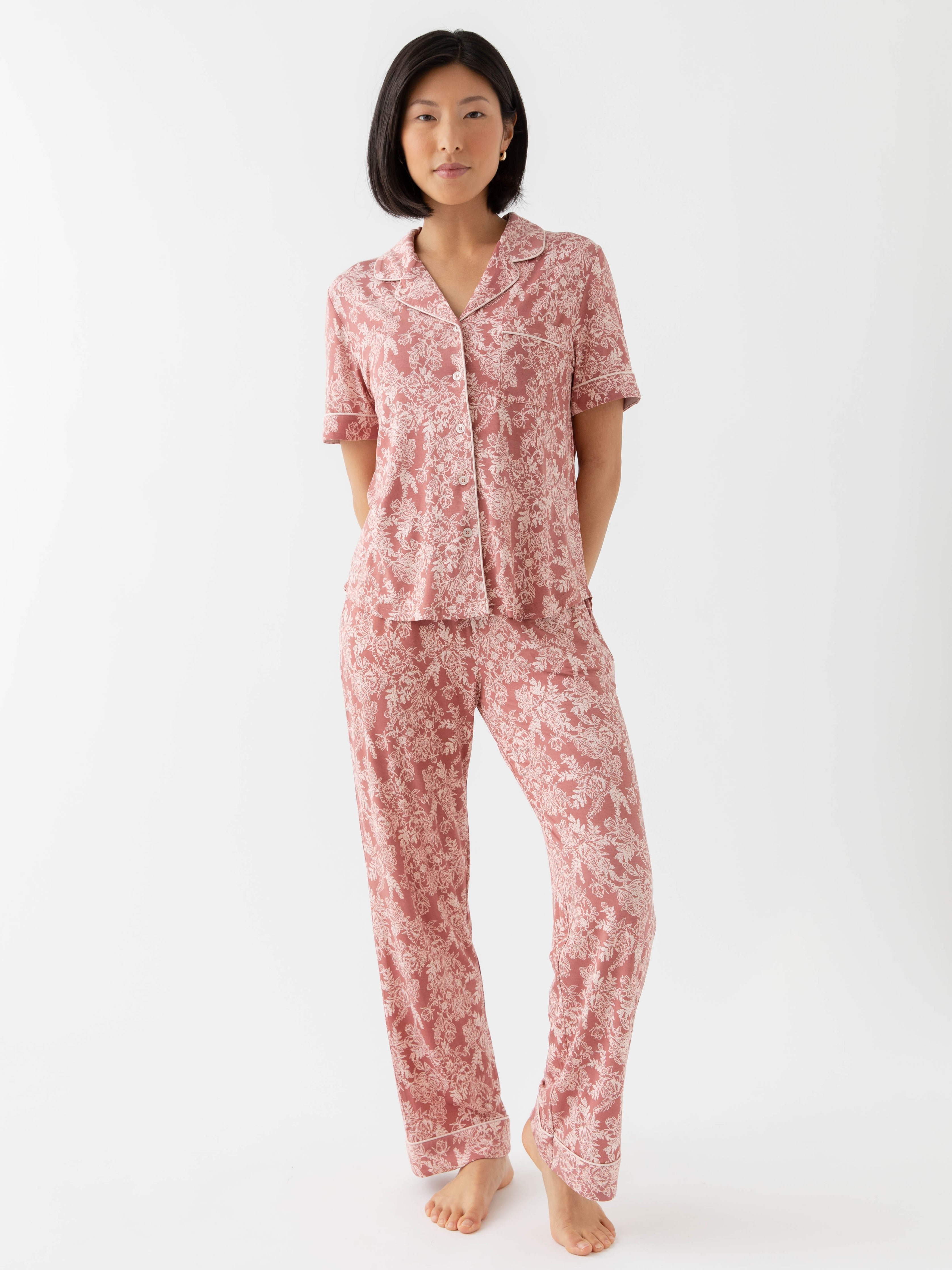 Rouge Toile Short Sleeve & Pant Bamboo Pajama Set modeled by a woman. The photo was taken in a high contrast setting, showing off the colors and lines of the pajamas. 