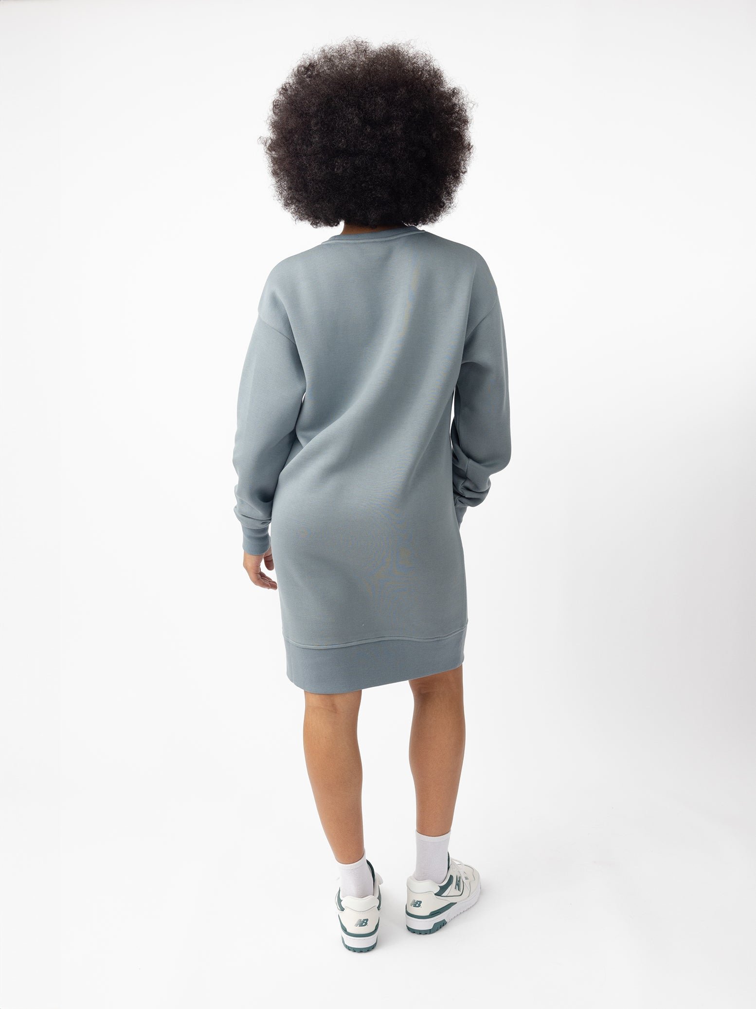 Woman wearing Smokey Blue CityScape Crewneck Dress with white background 