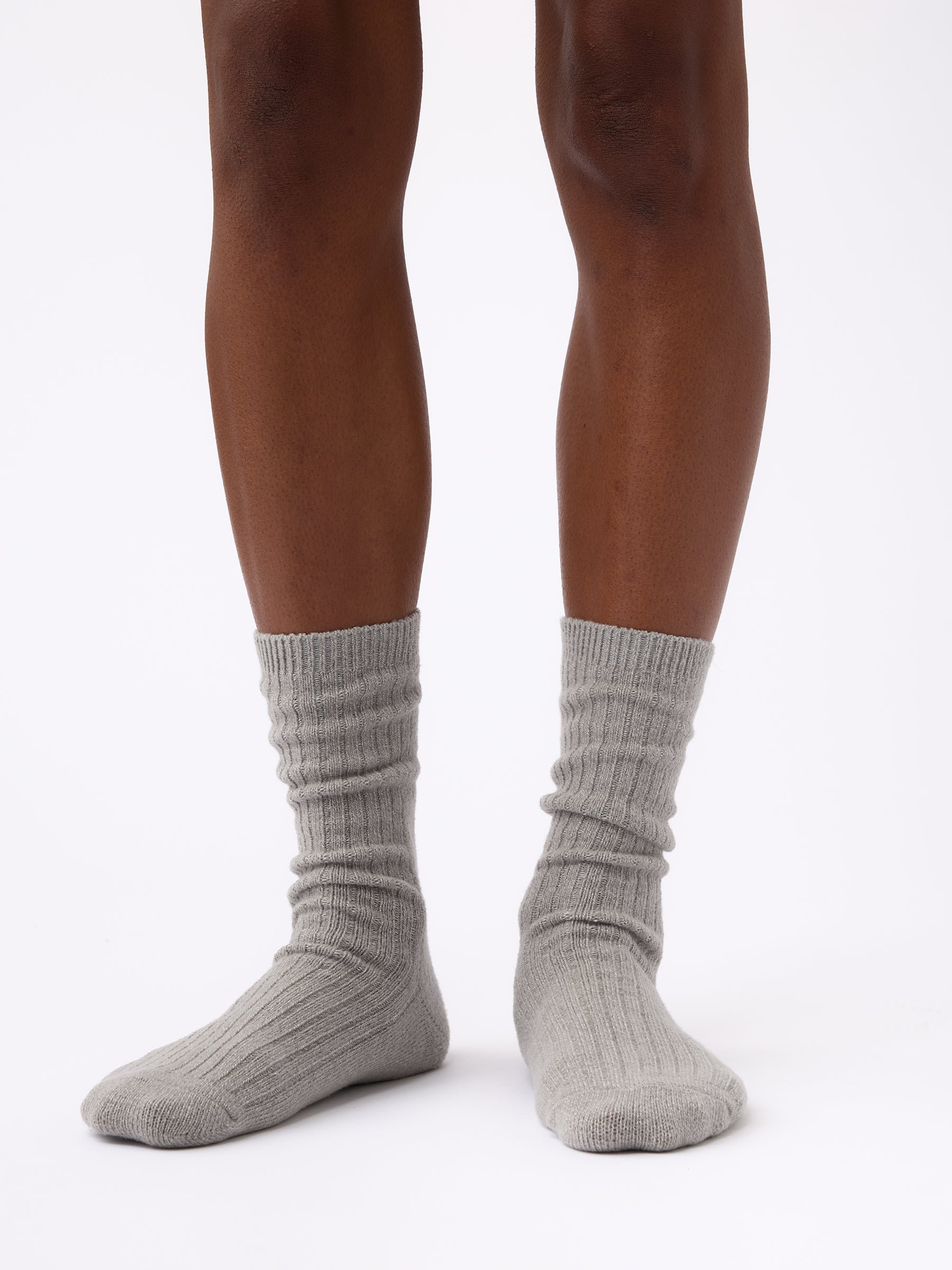 Person wearing Cozy Earth Plush Lounge Sock 1-Pack in Stone 