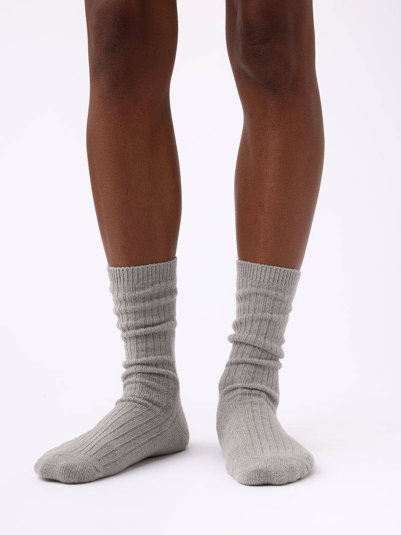 Person wearing Cozy Earth Plush Lounge Calf Sock 1-Pack in Stone