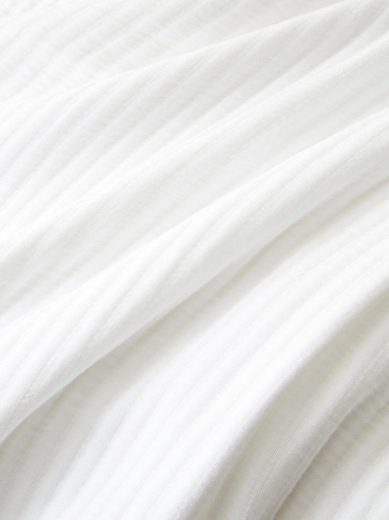 Close up of white coverlet fabric