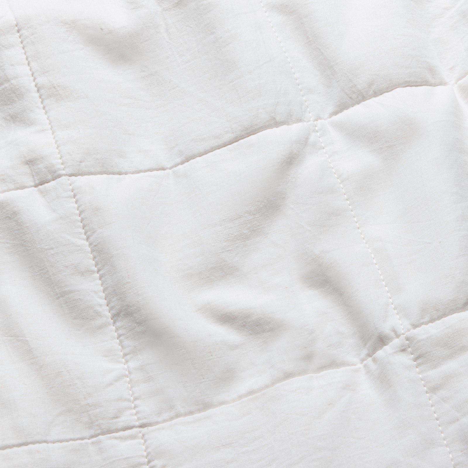 White Linen Box Quilted Sham Euro photographed close up. 