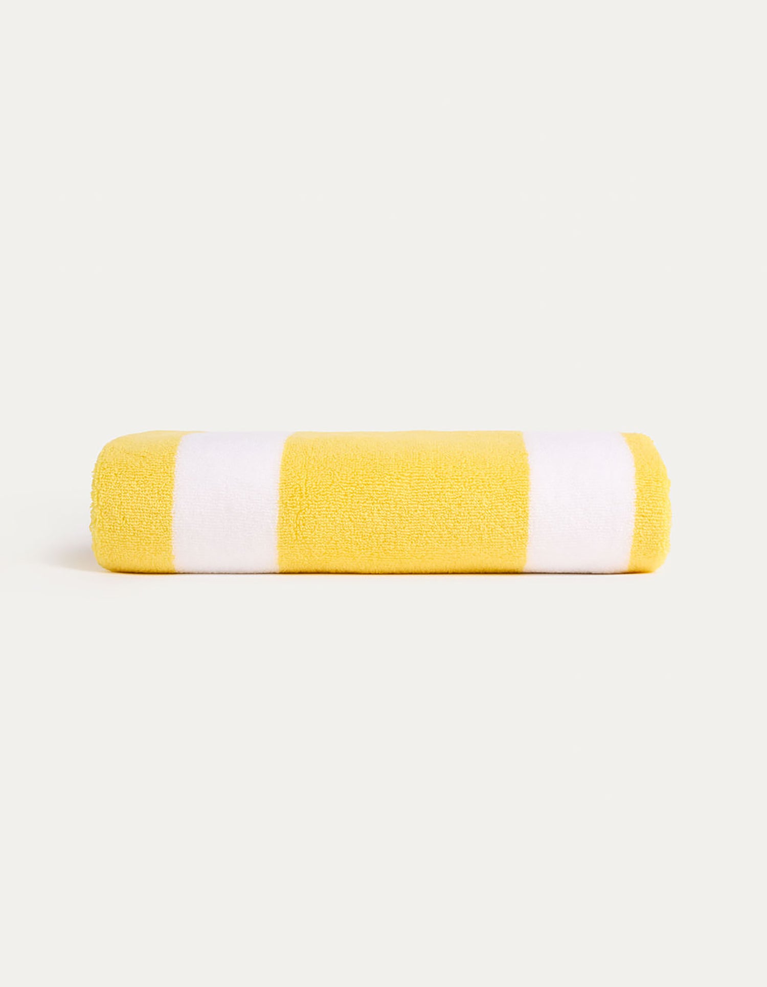 The Classic Stripe Resort Towel by Cozy Earth features alternating yellow and white horizontal stripes against a plain background. |Color:Lemon