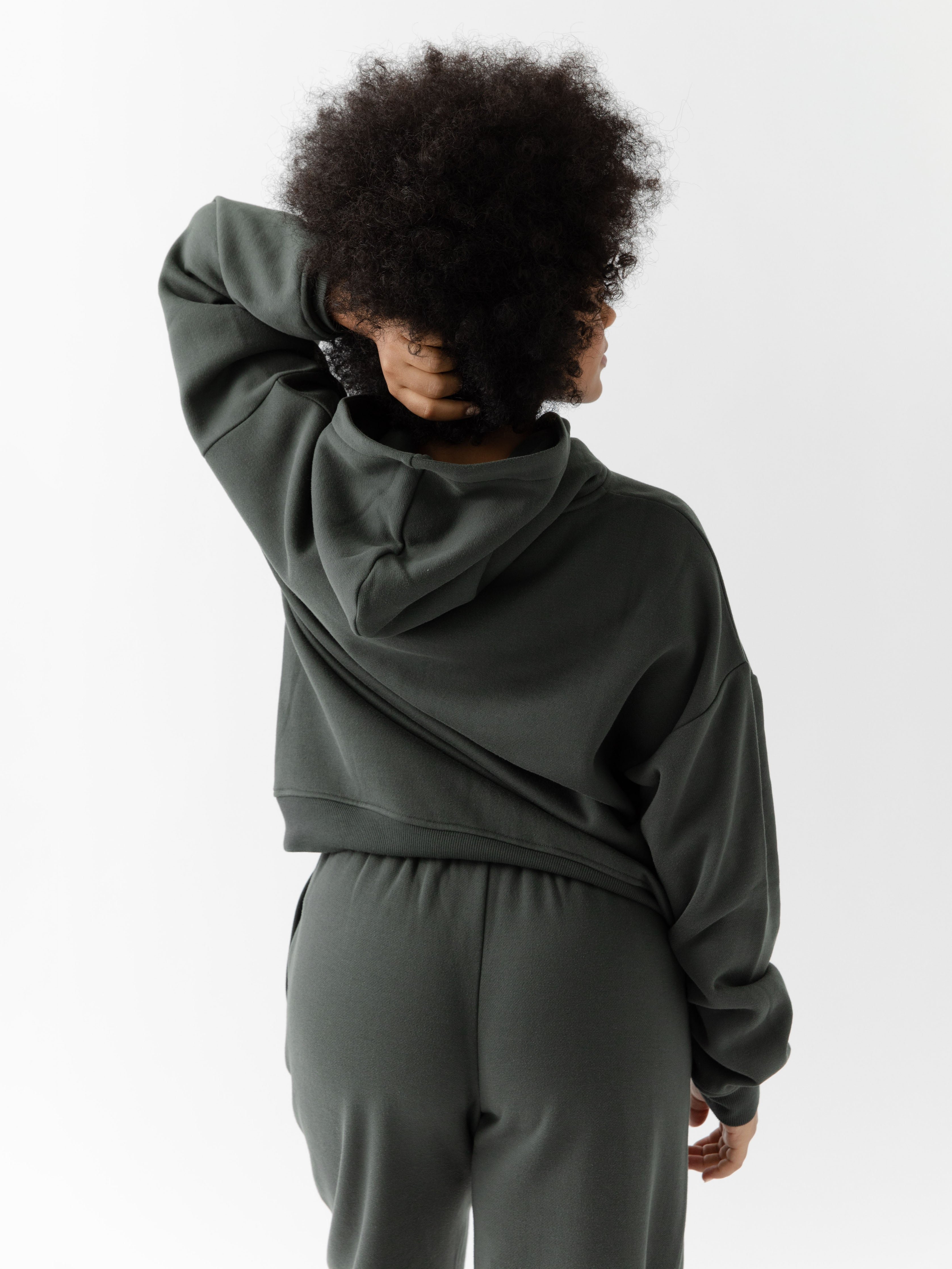 Back of woman wearing storm cityscape hoodie 