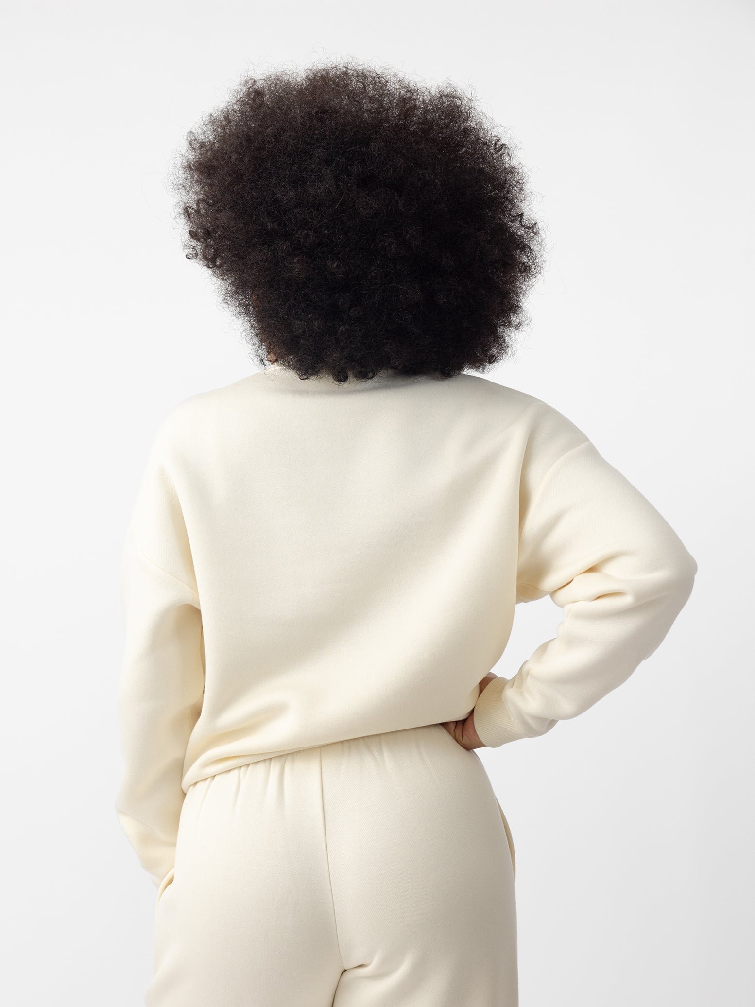 Woman wearing Alabaster CityScape Crewneck with white background 