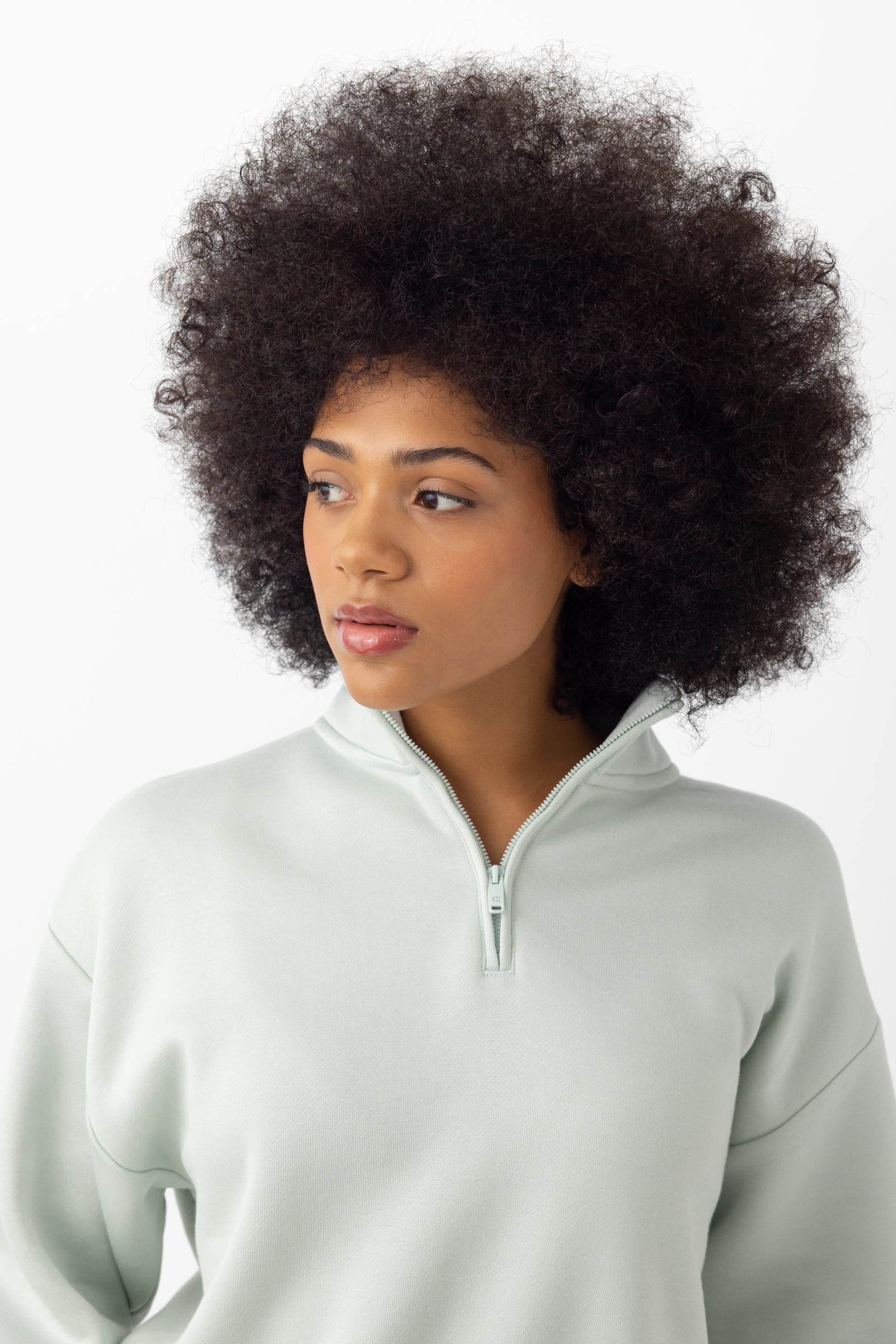 Arctic CityScape Quarter Zip. The quarter zip is being worn by a female model. The photo was taken with a white background. 