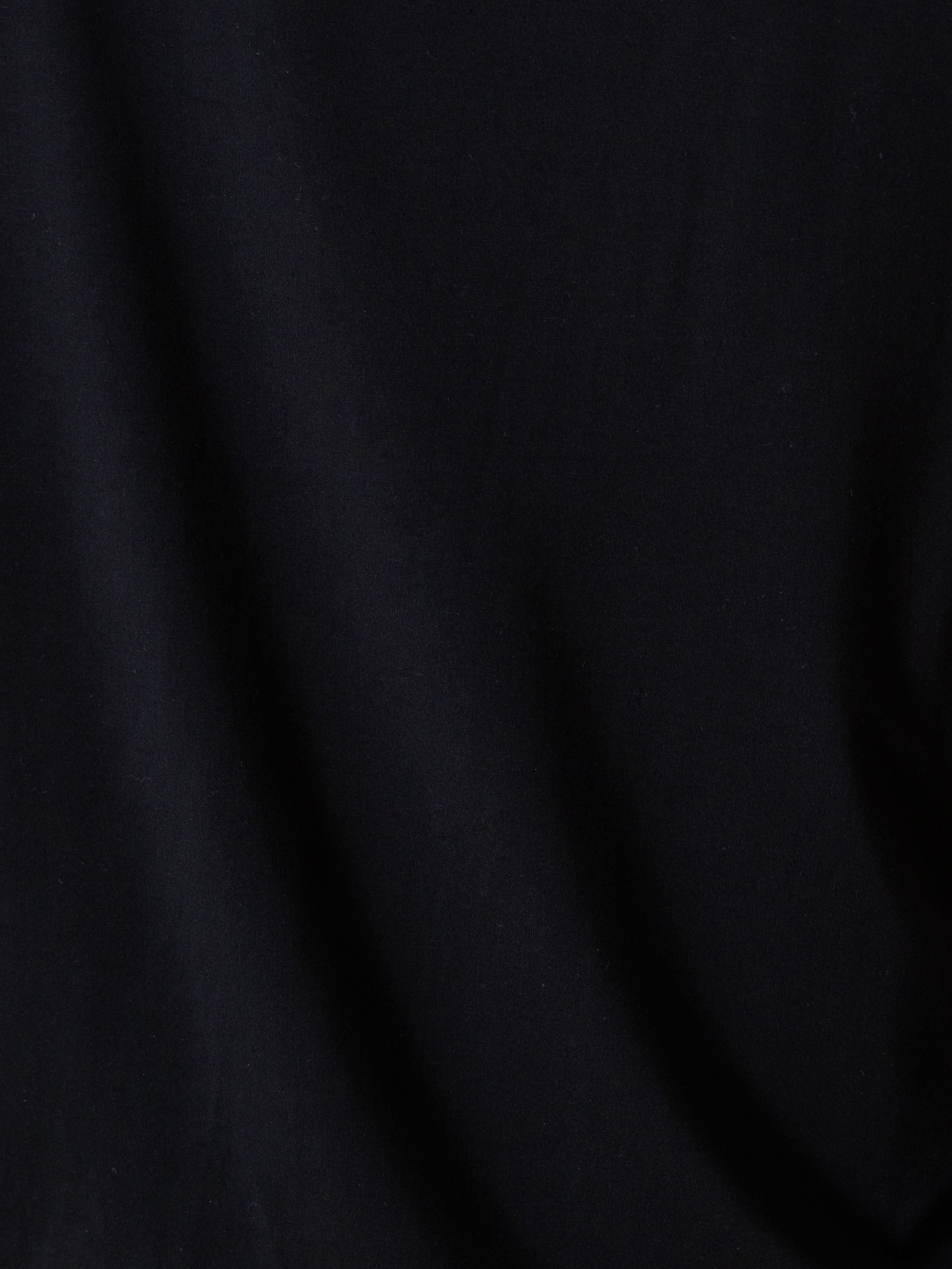 Black Short Sleeve Pajama Set. The photo was taken close up, showing off the print of the pajamas. 