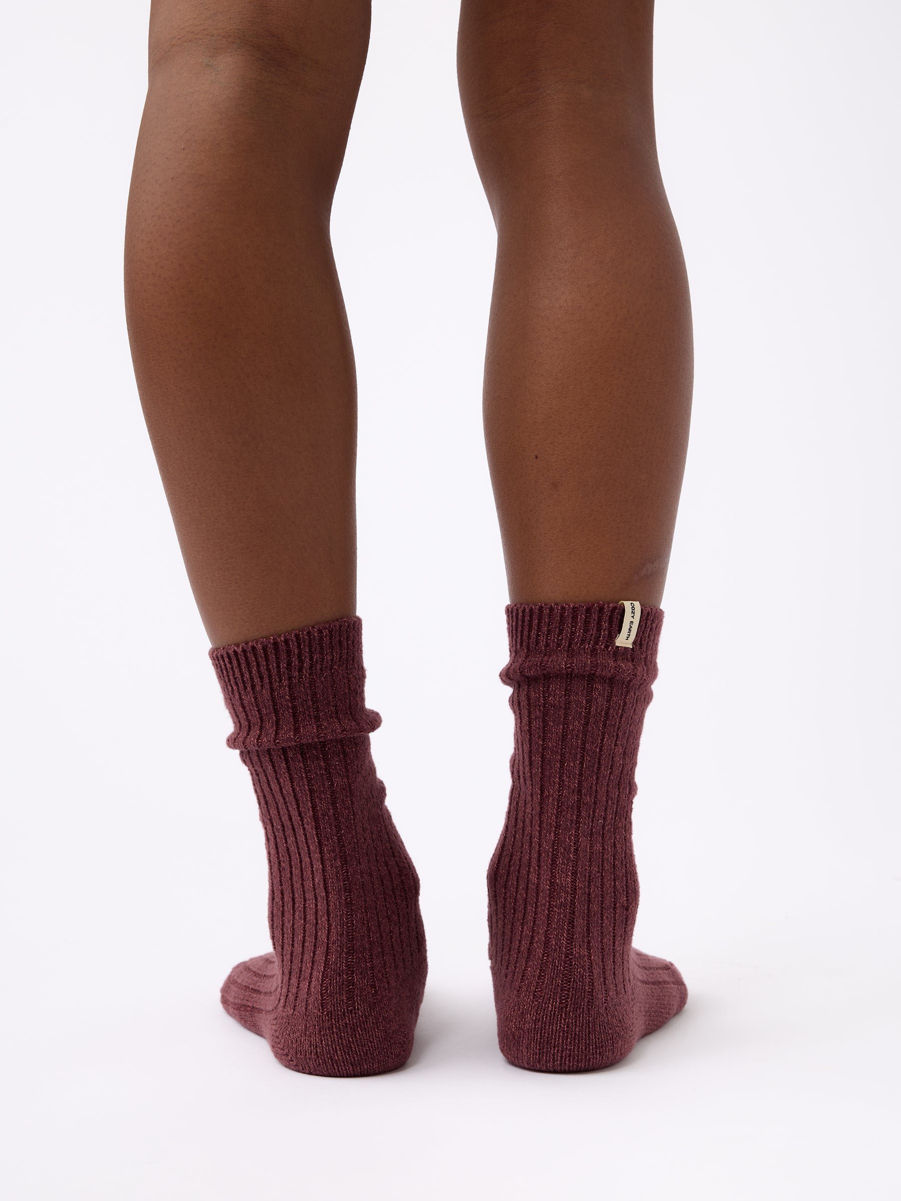 Person wearing Cozy Earth Plush Lounge Sock in Burgundy 