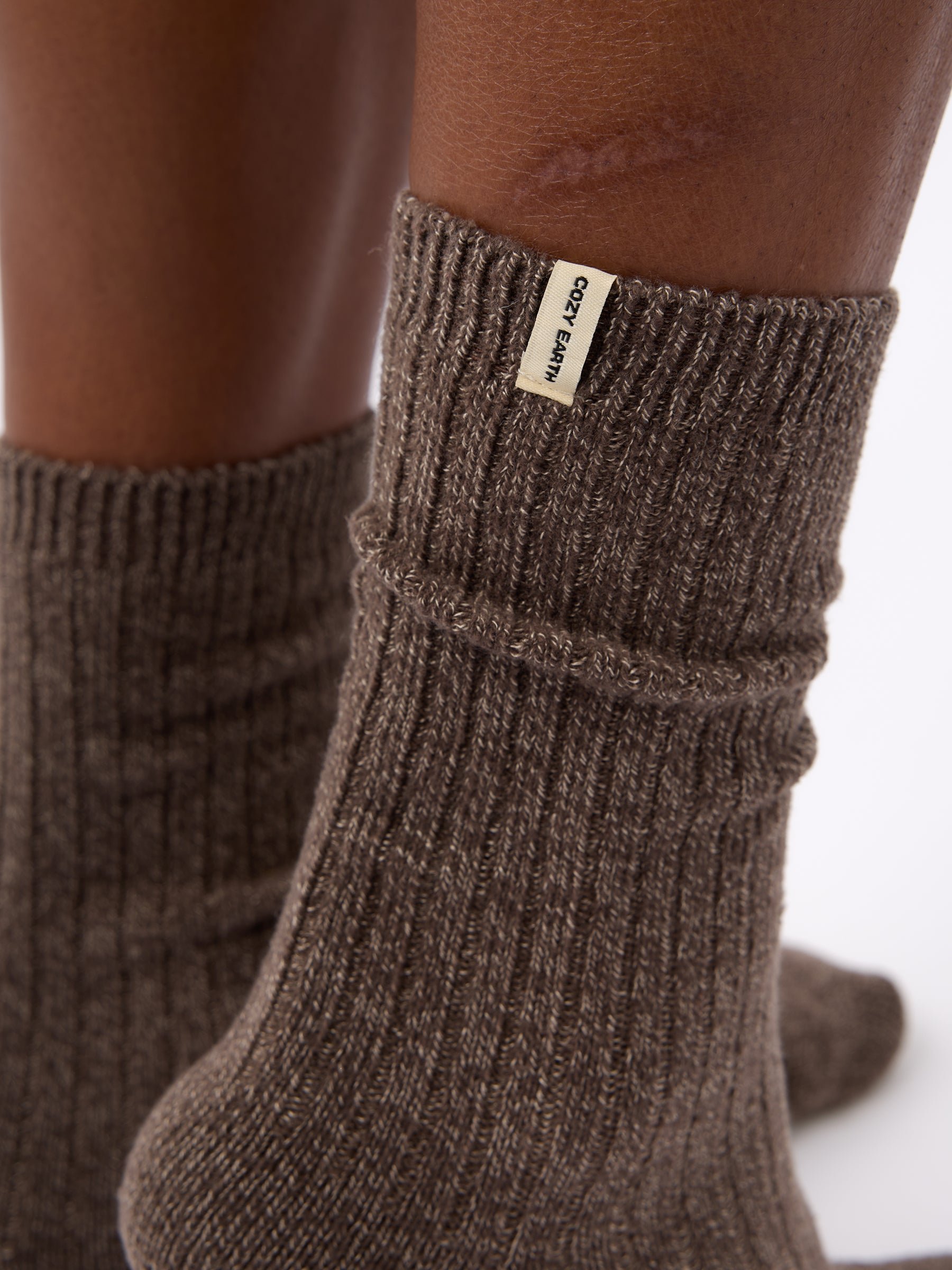 Close-up of tag on Cozy Earth Plush Lounge Sock in Cacao 
