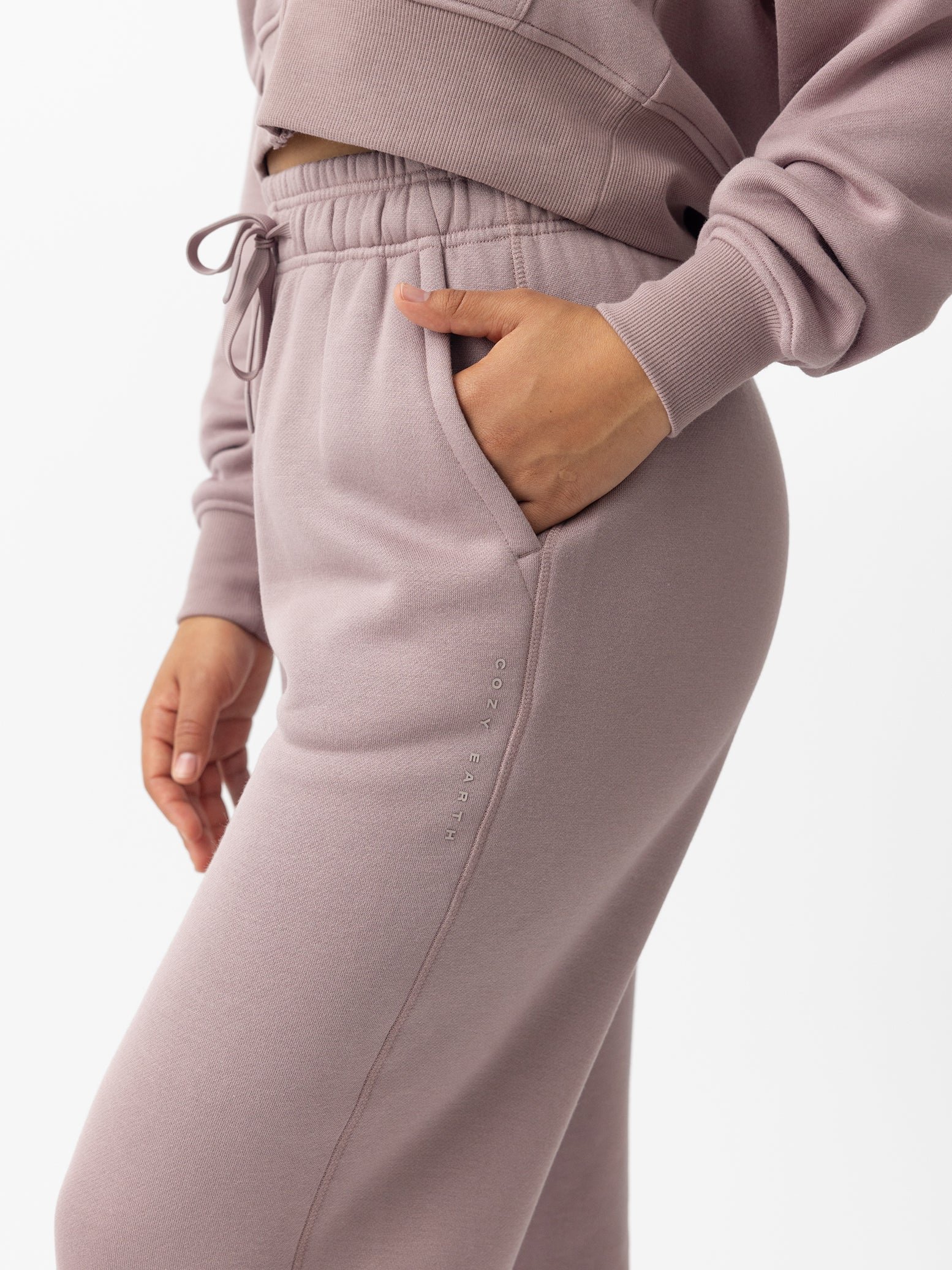 Woman wearing Dusty Orchid CityScape Wide Leg Pant with white background 