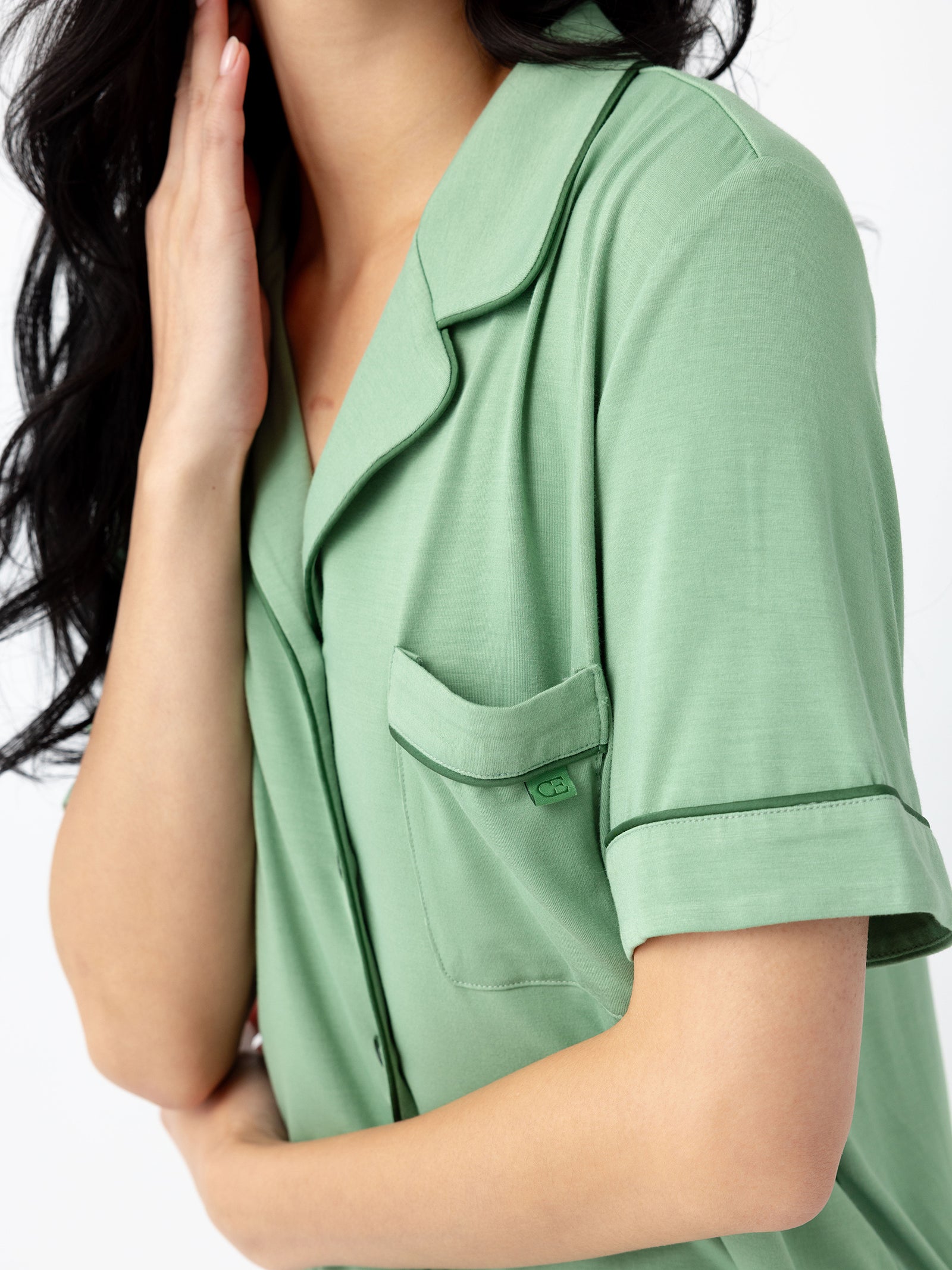 Close-up of woman wearing Women's Short Sleeve Bamboo Pajama Top in Stretch-Knit - Fern 