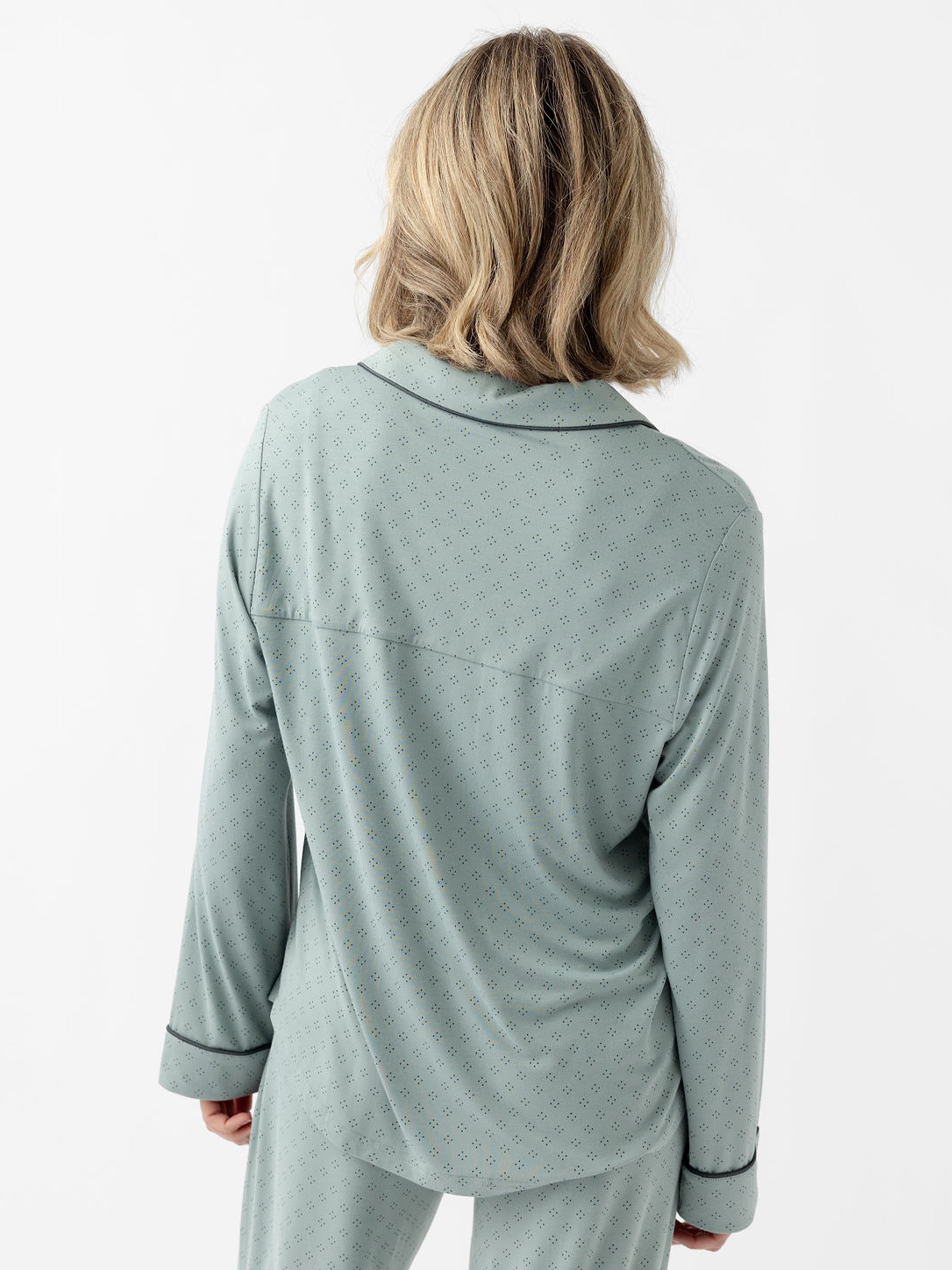Back of woman wearing haze diamond dot pajama top with white background 