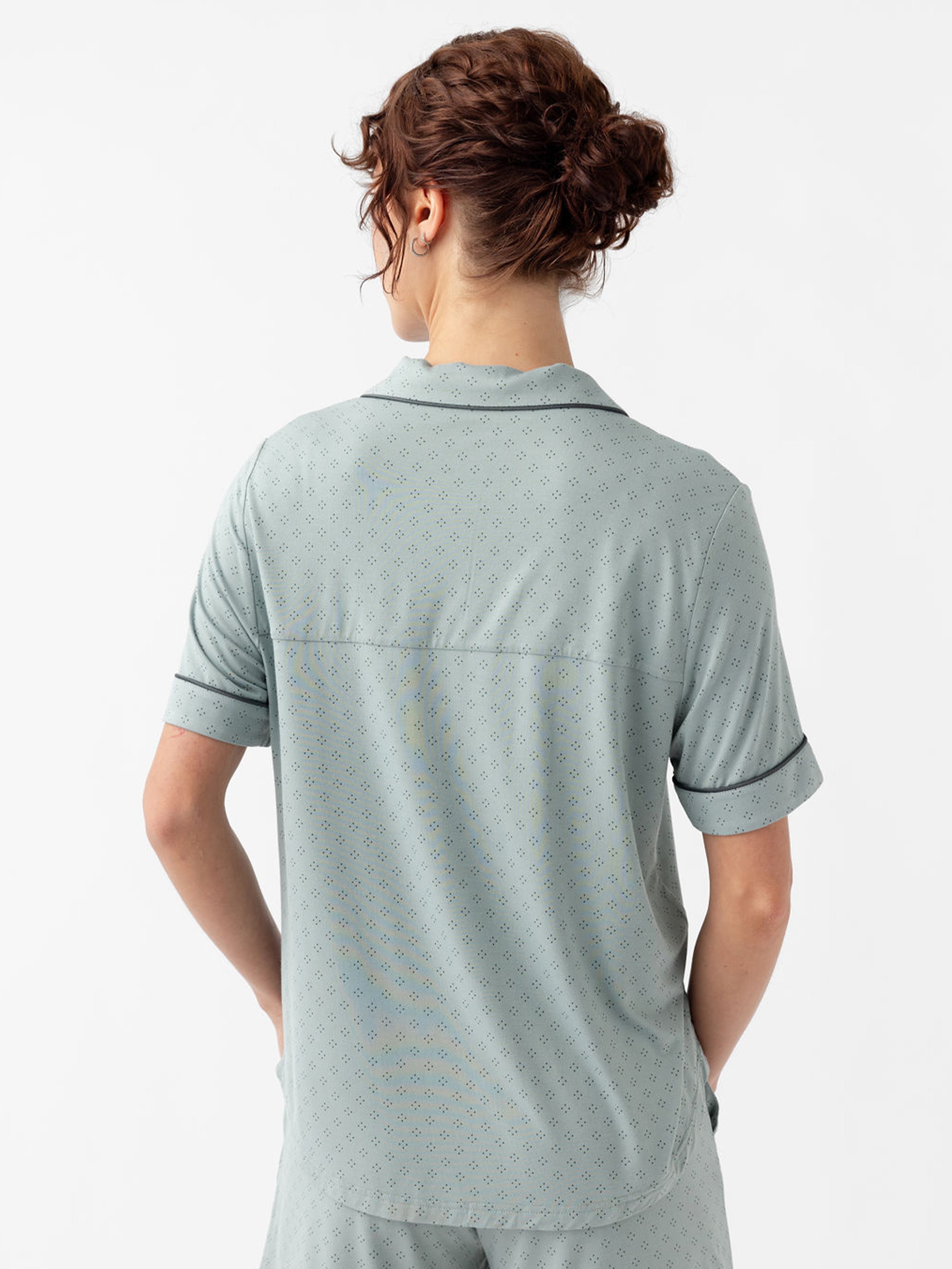 Back of woman wearing haze diamond dot pajama top with white background 