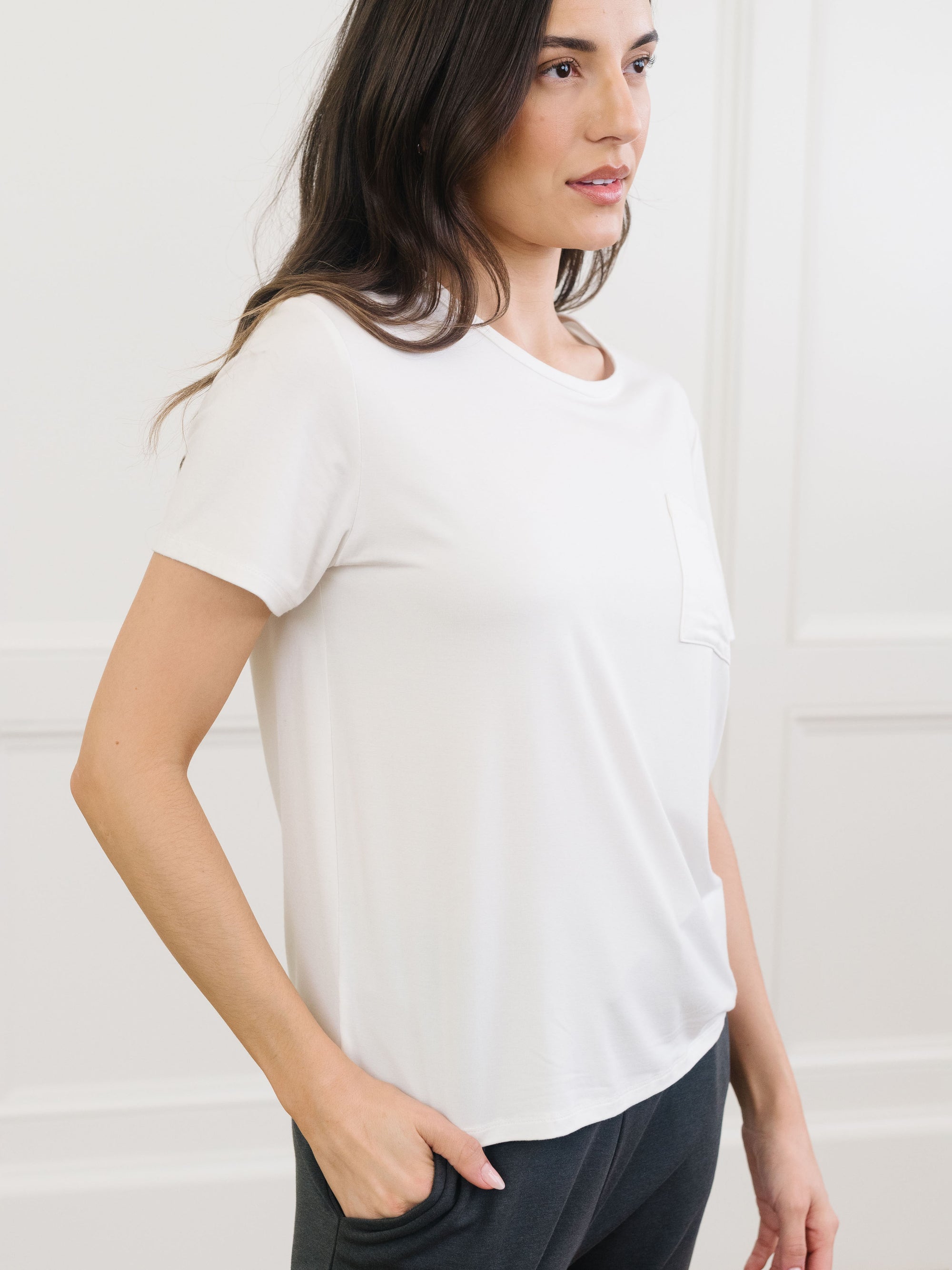 Woman wearing Cozy Earth Bamboo Lounge Tee in ivory shown from the waist up 