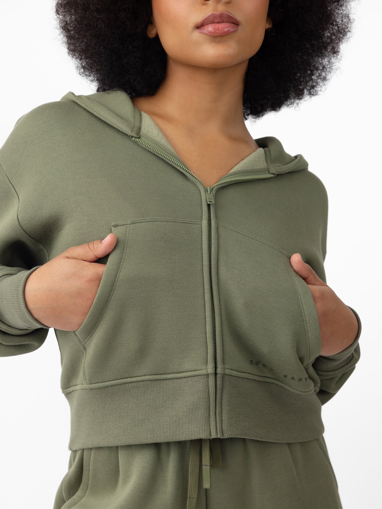 Woman wearing Juniper CityScape Cropped Full Zip with white background 