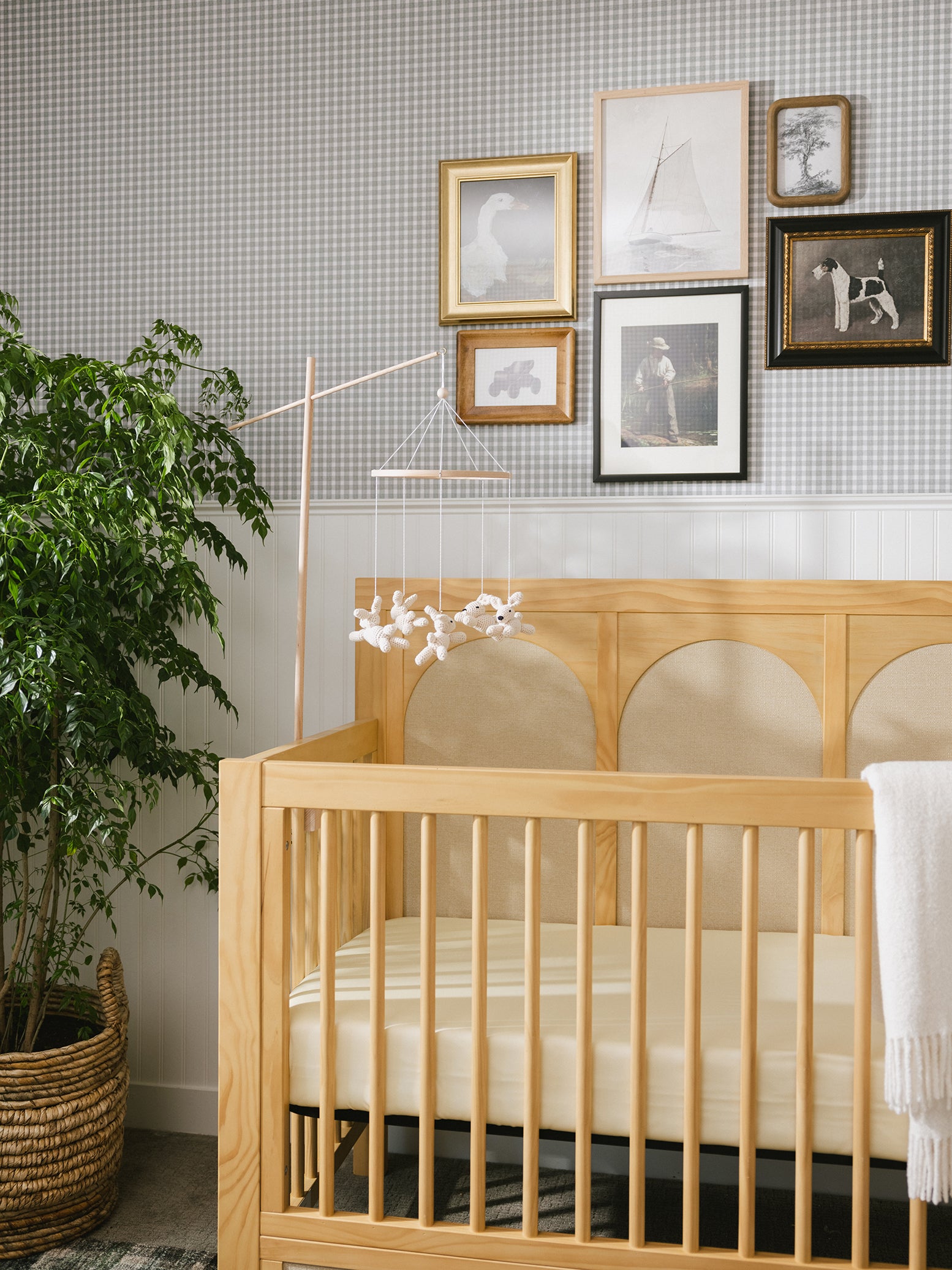 Lemonade Bamboo Crib Sheet placed on a baby mattress in a baby crib. 