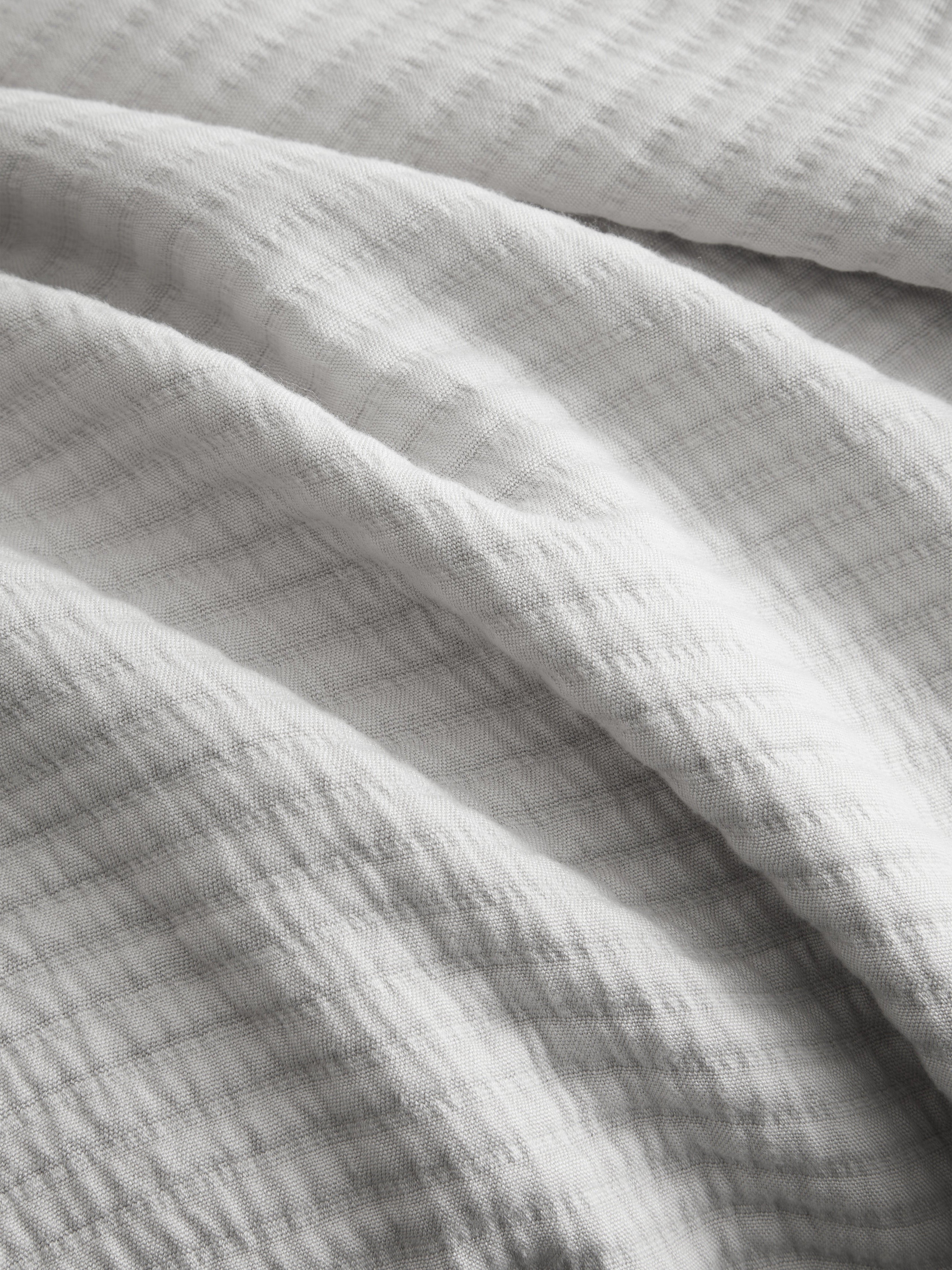 Close up of light grey coverlet fabric |Color:Light Grey
