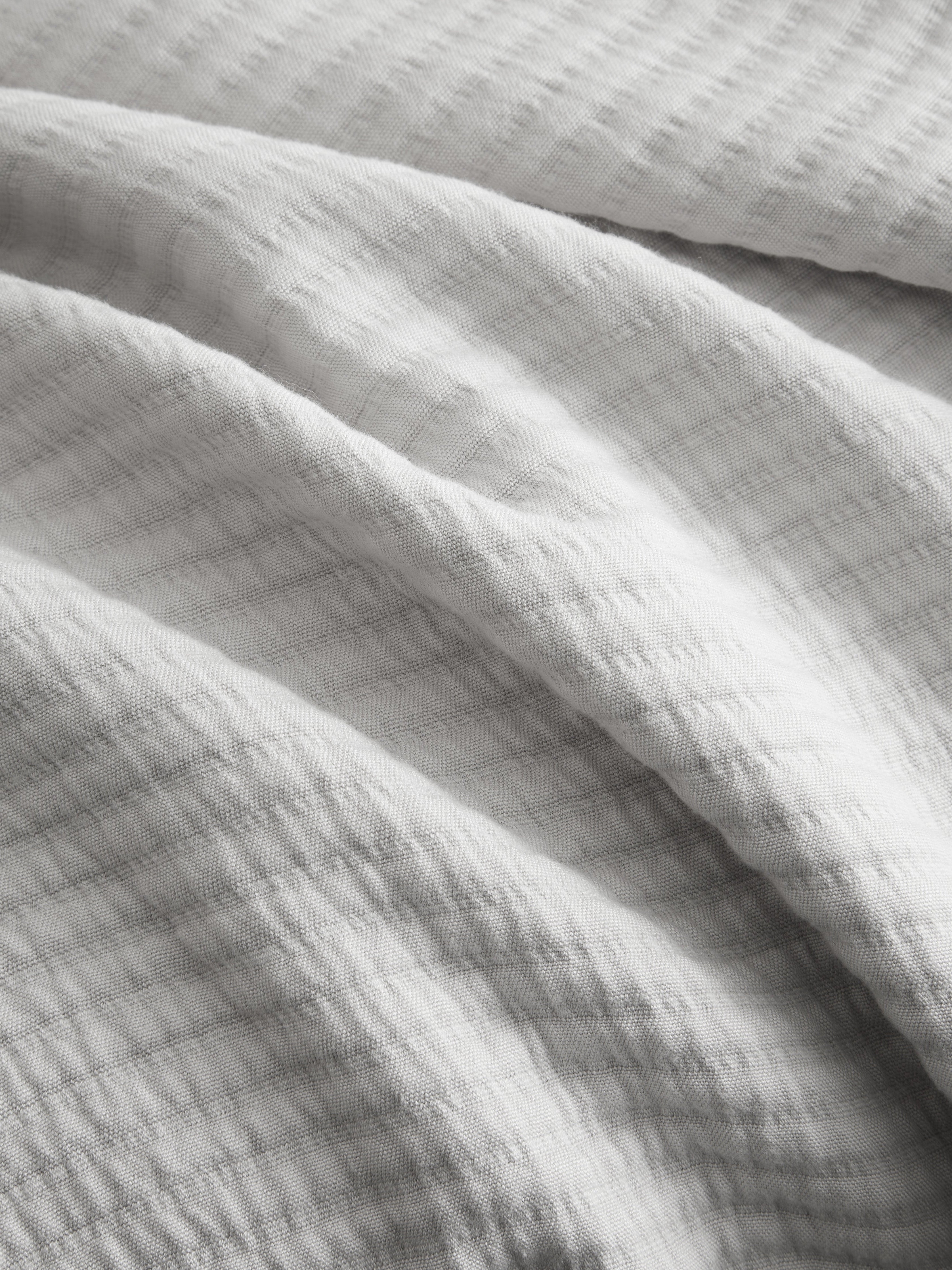 Close up of light grey coverlet fabric |Color:Light Grey