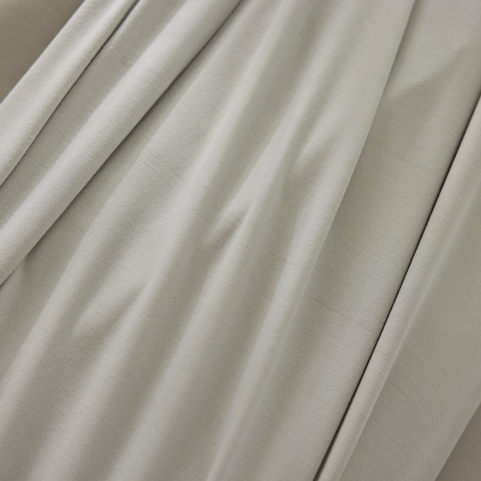 Close up of light grey bamboo jersey fabric 