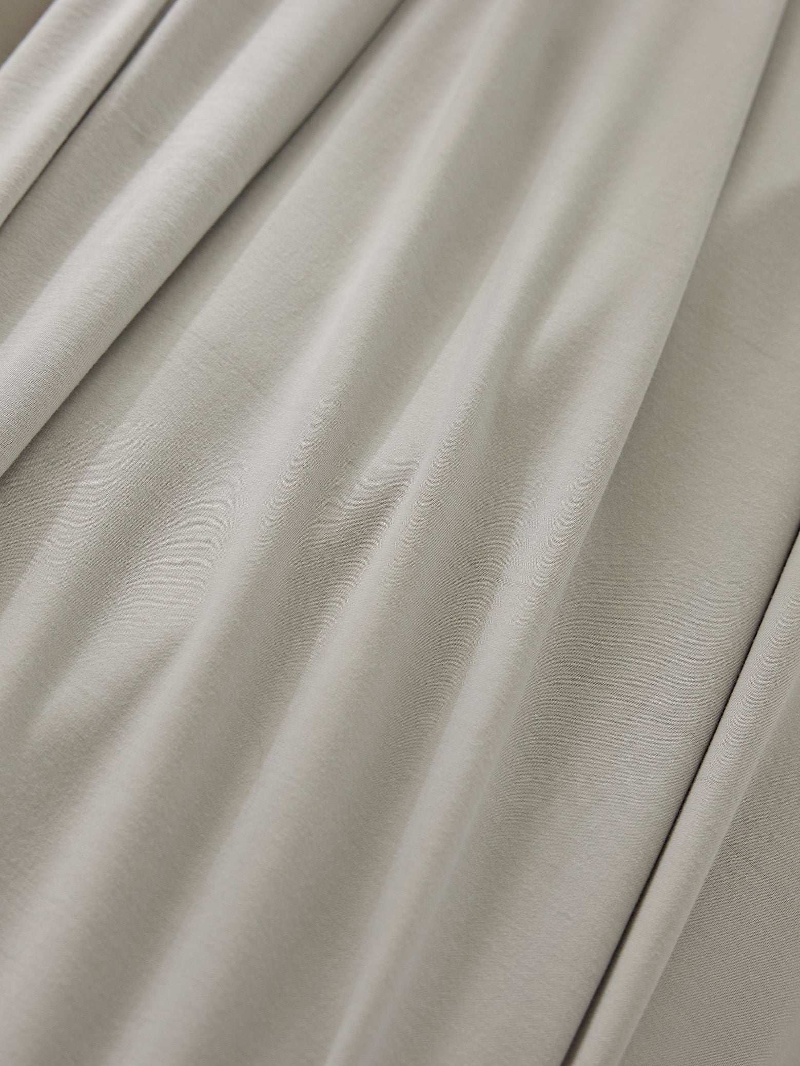 Close up of light grey bamboo jersey fabric 