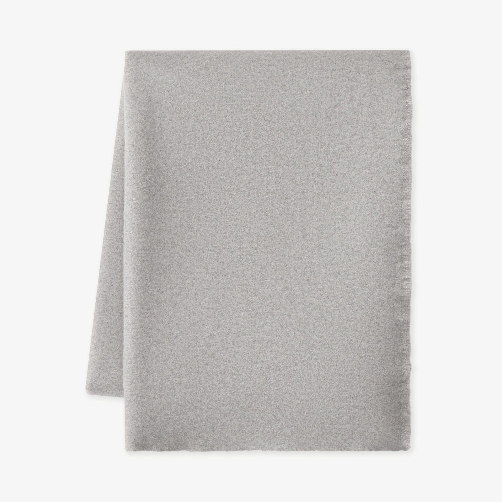 Flat lay of pebble fringe blanket with white background 