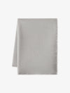 The Cashmere Fringe Blanket by Cozy Earth, shown in light gray and rectangular shape, is displayed flat on a white background with one corner folded over.|Color:Pebble