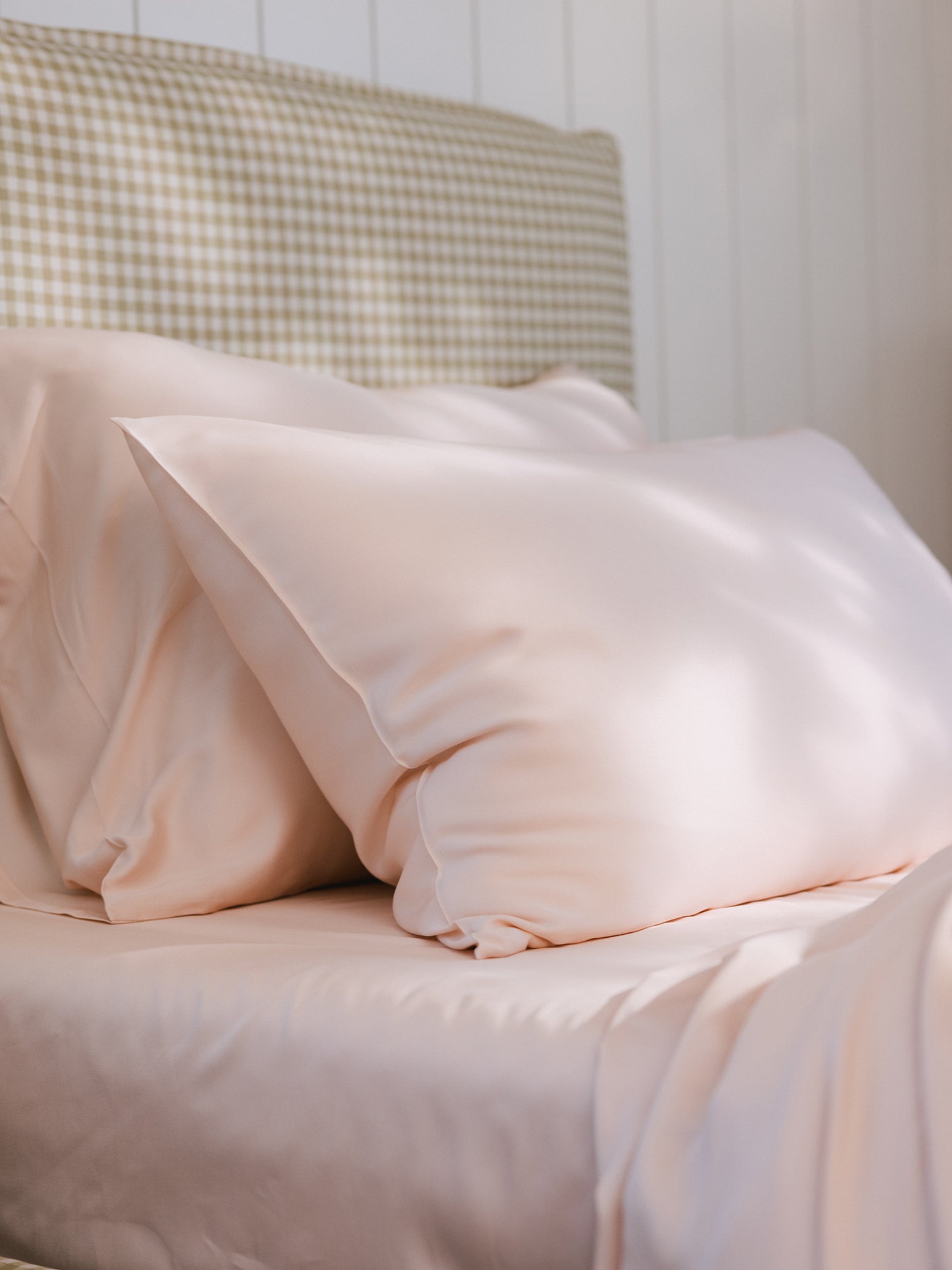 Peony Pillowcases on bed. Photo taken close up to show the texture of the pillowcases standard/king. 