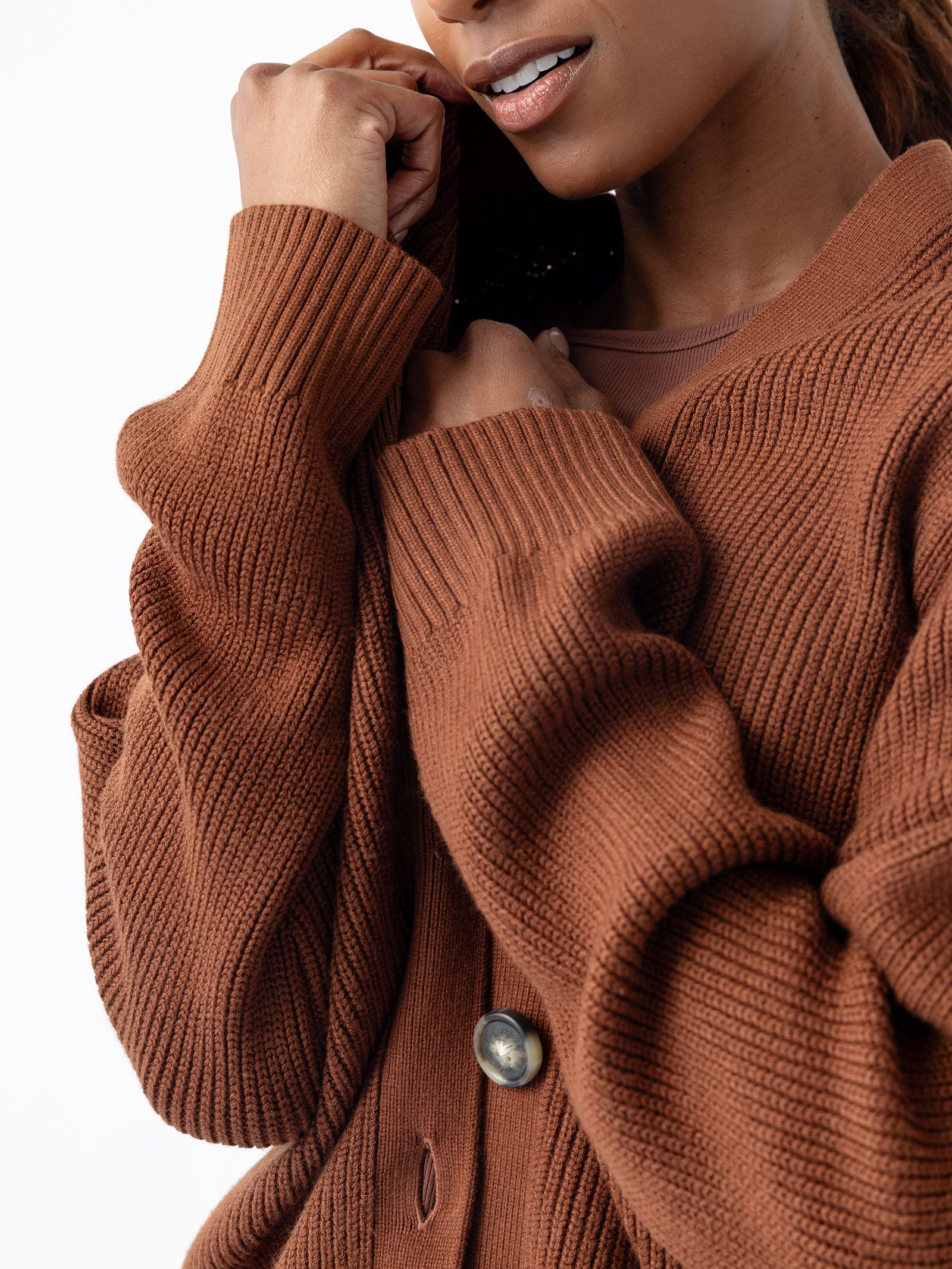 Close-up of woman in Oversized Classic Cardigan - Spice 