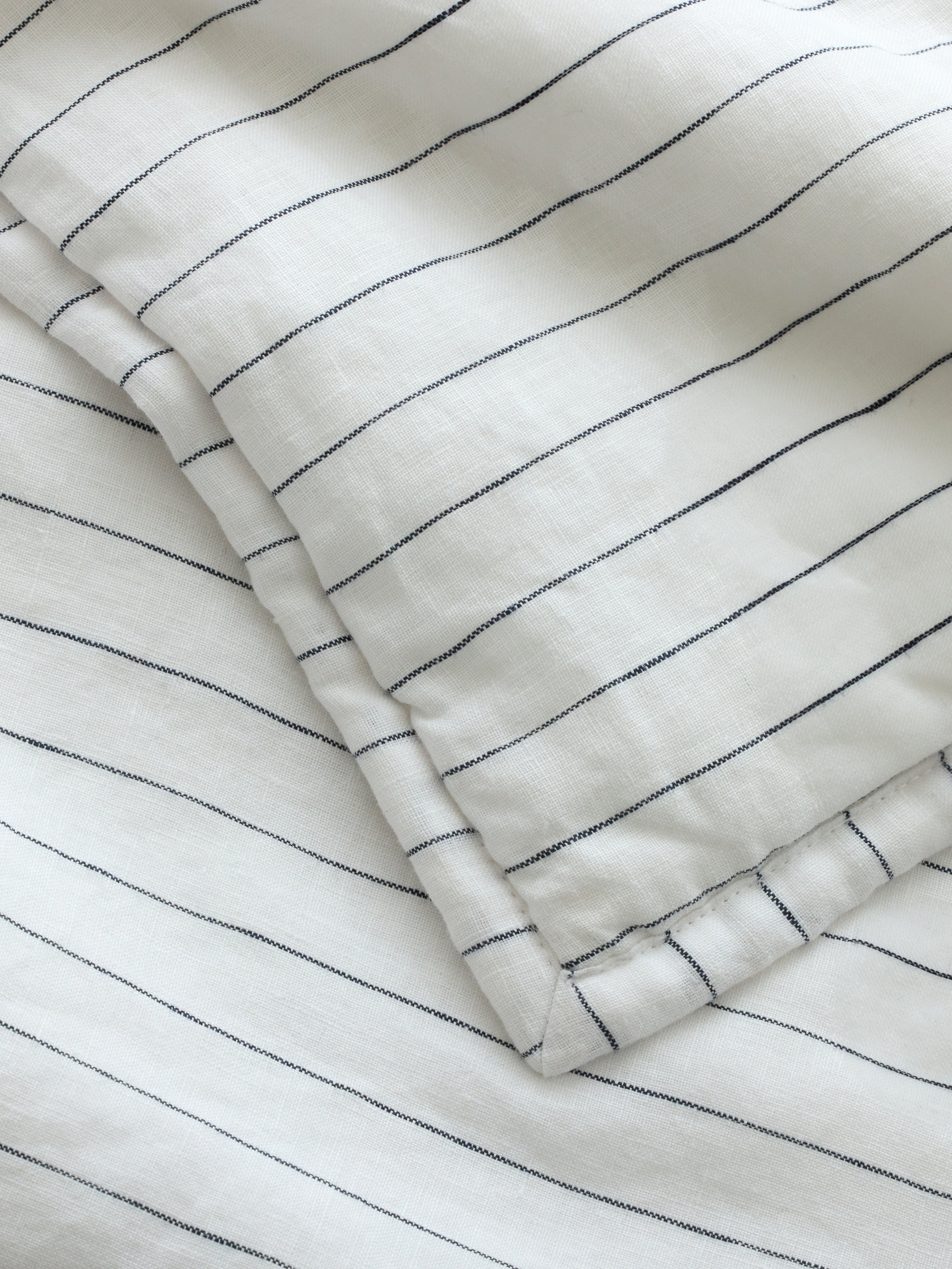 Close up of charcoal pencil stripe fabric 