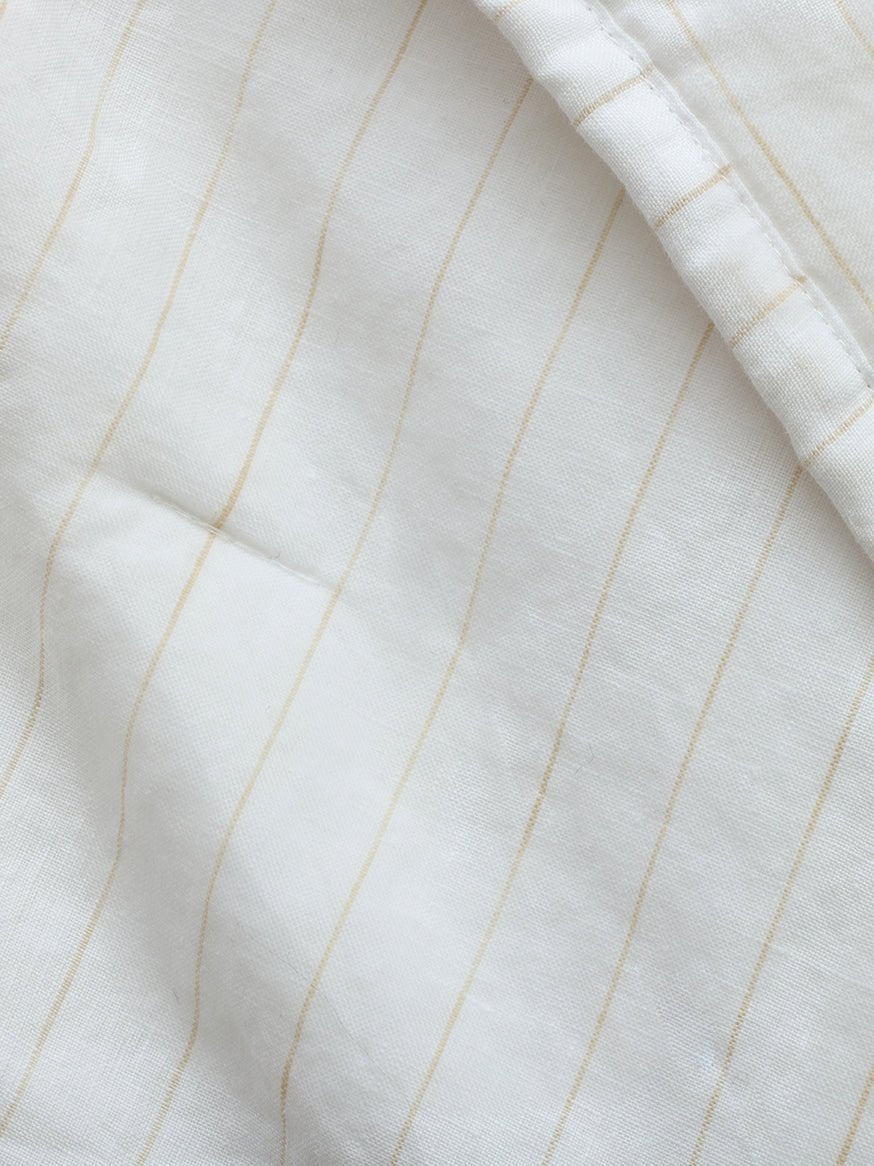 Close up of flax pencil stripe fabric 