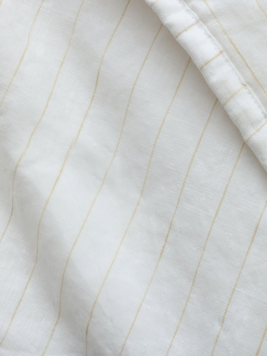 Close up of flax pencil stripe quilt 