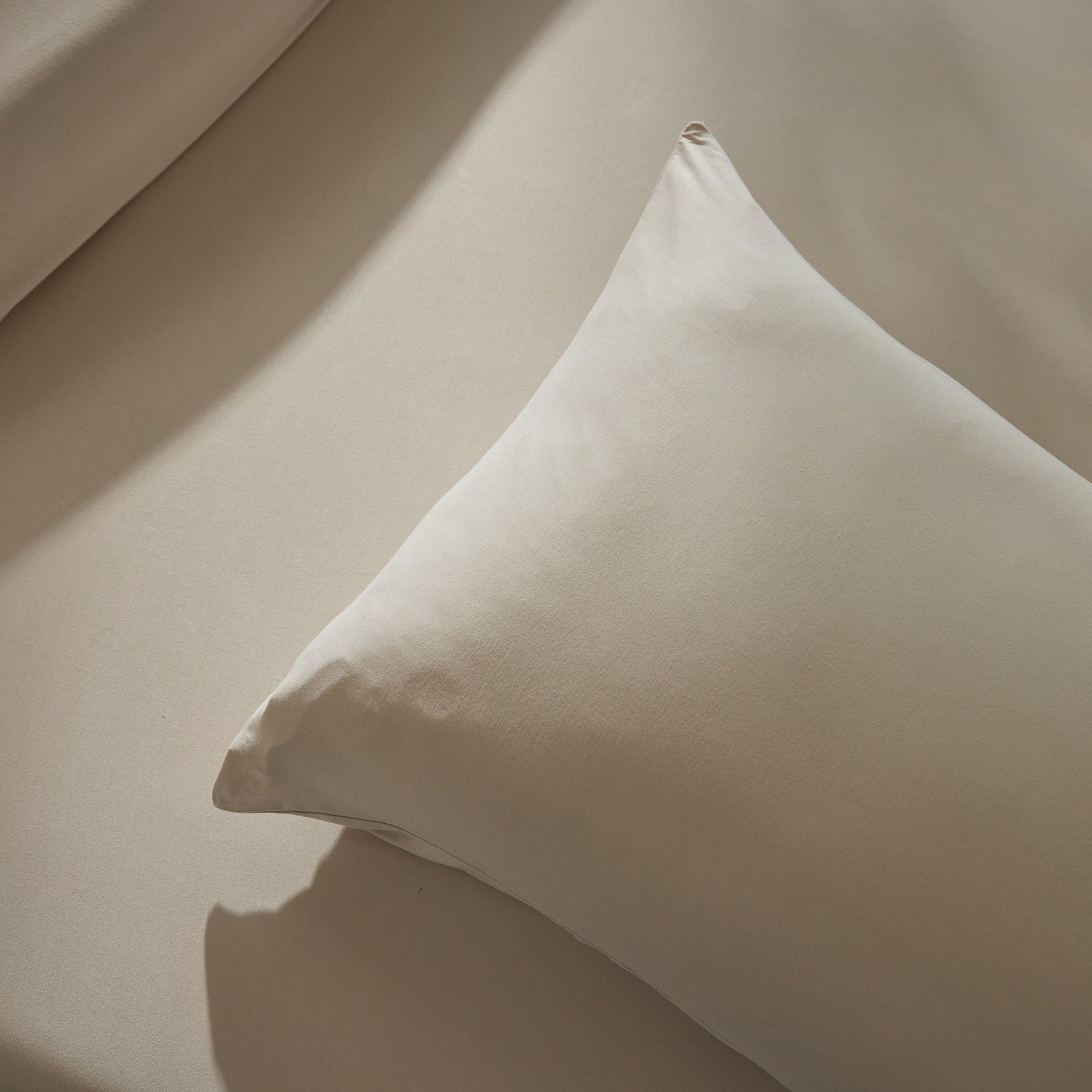 Close up of birch fitted sheet and pillowcase 