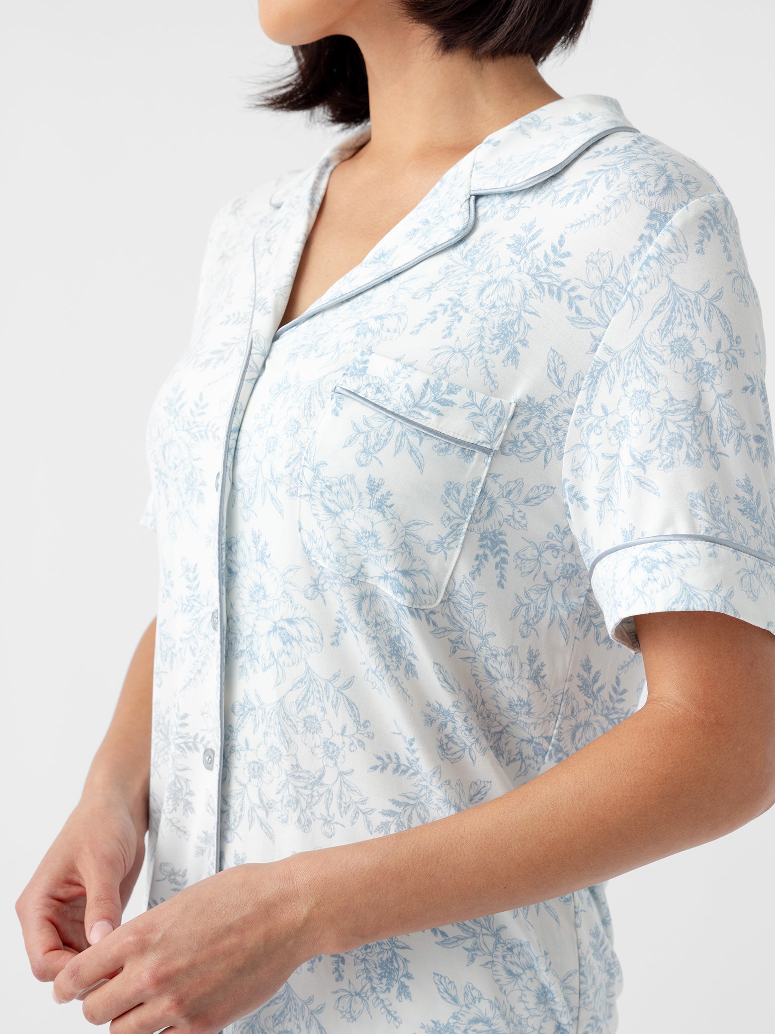 Close up of woman in blue toile short sleeve pajama top 