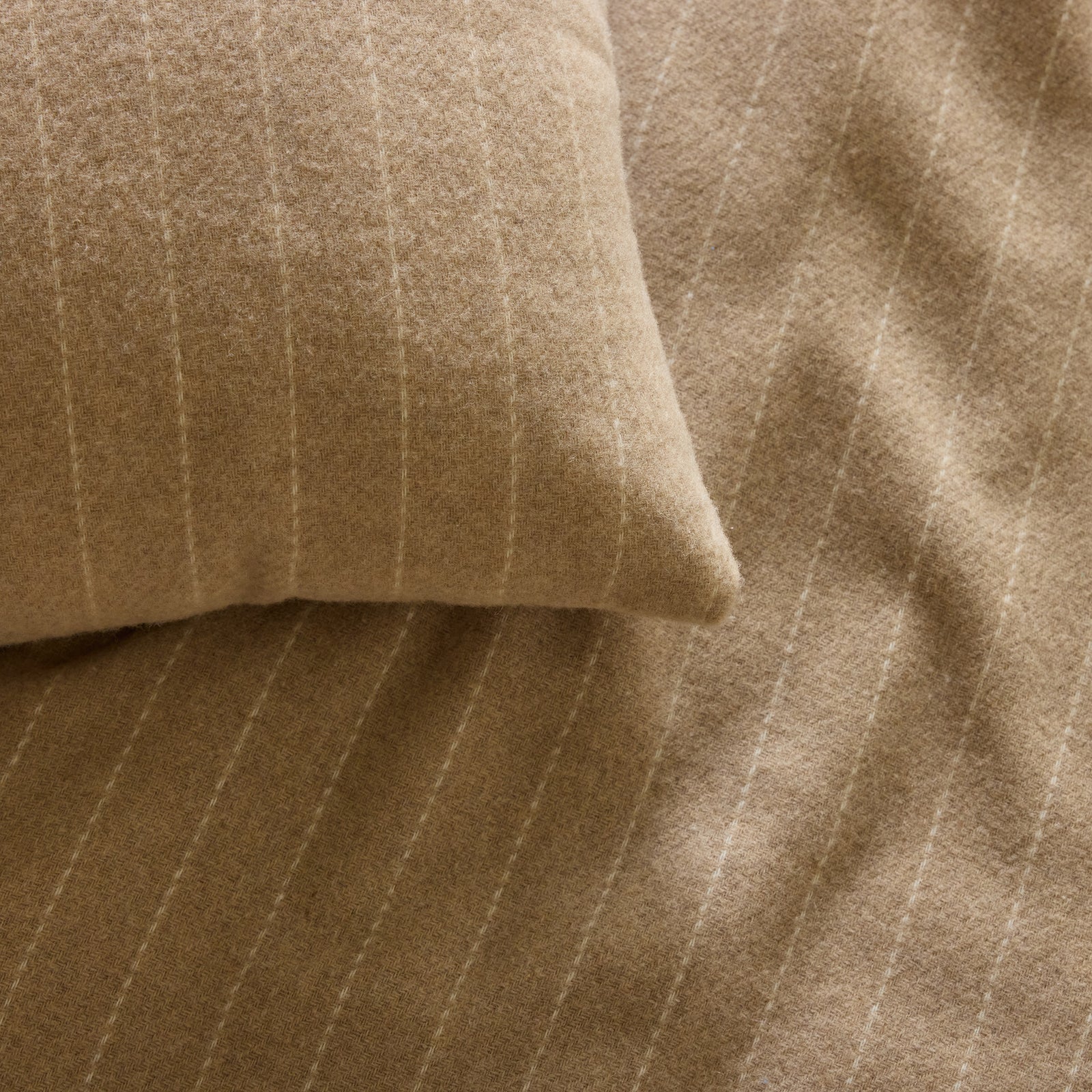 Close up of brandy florence pillow and blanket 