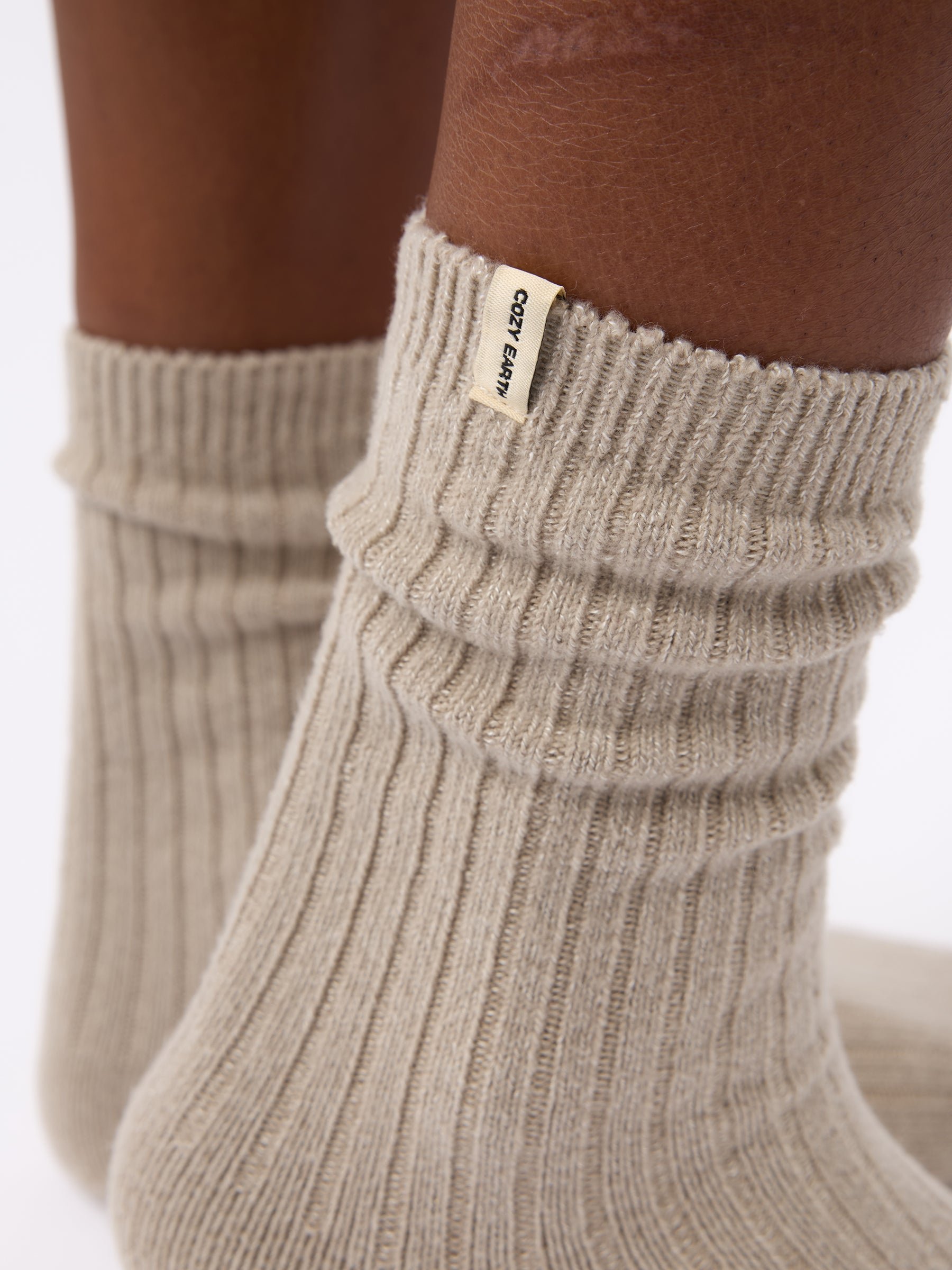 Close-up of tag on Cozy Earth Plush Lounge Sock in Taupe 